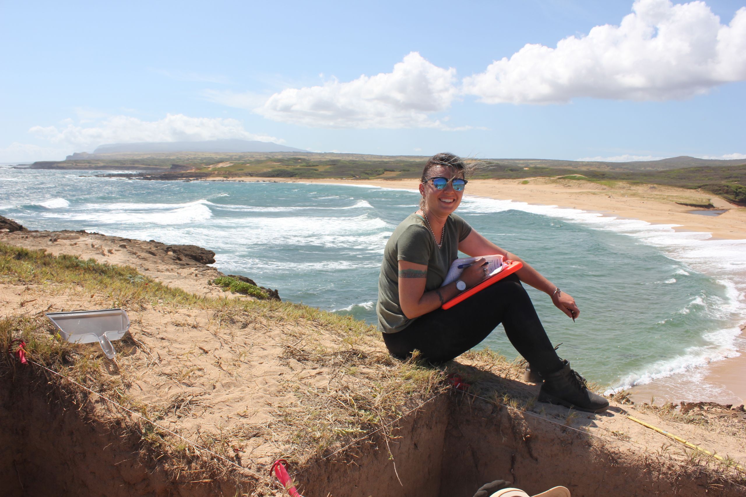 Georgie Wye recording the stratigraphic information for one of the excavation pits.     