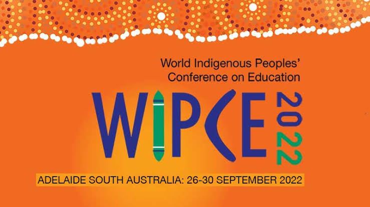 Text reading World Indigenous Peoples' Conference on Education (WIPCE) 2022 on an orange background. Indigenous Australian artwork is above the text.