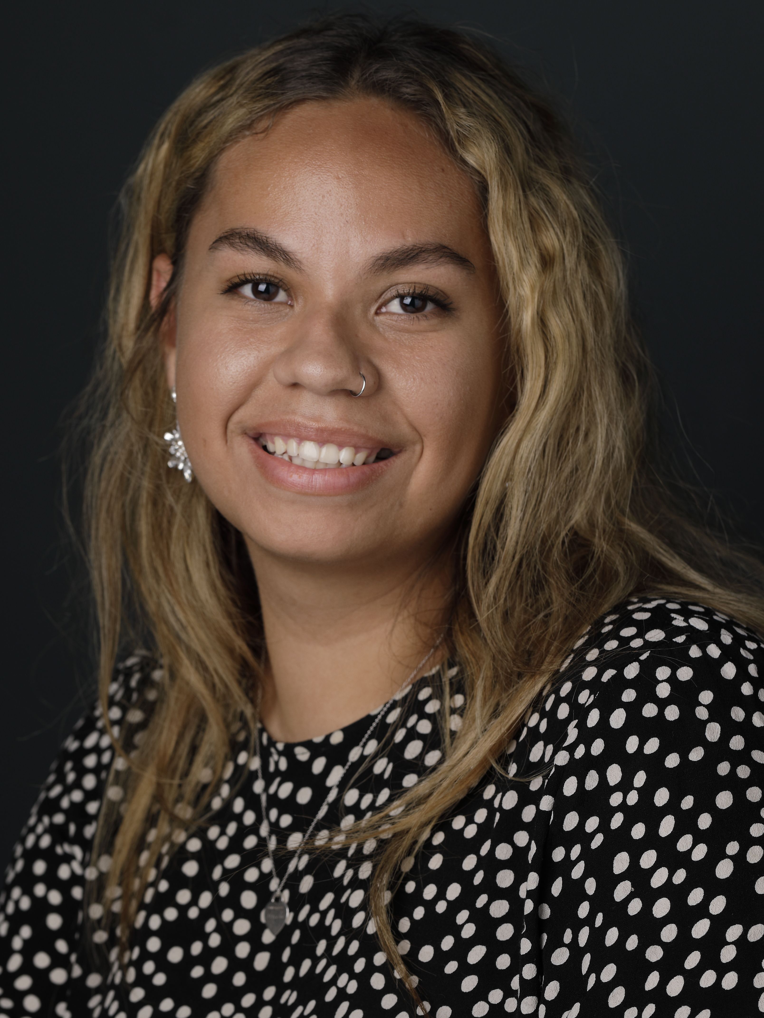 Arielle Henaway, a young woman with blonde shoulder-length hair, smiling