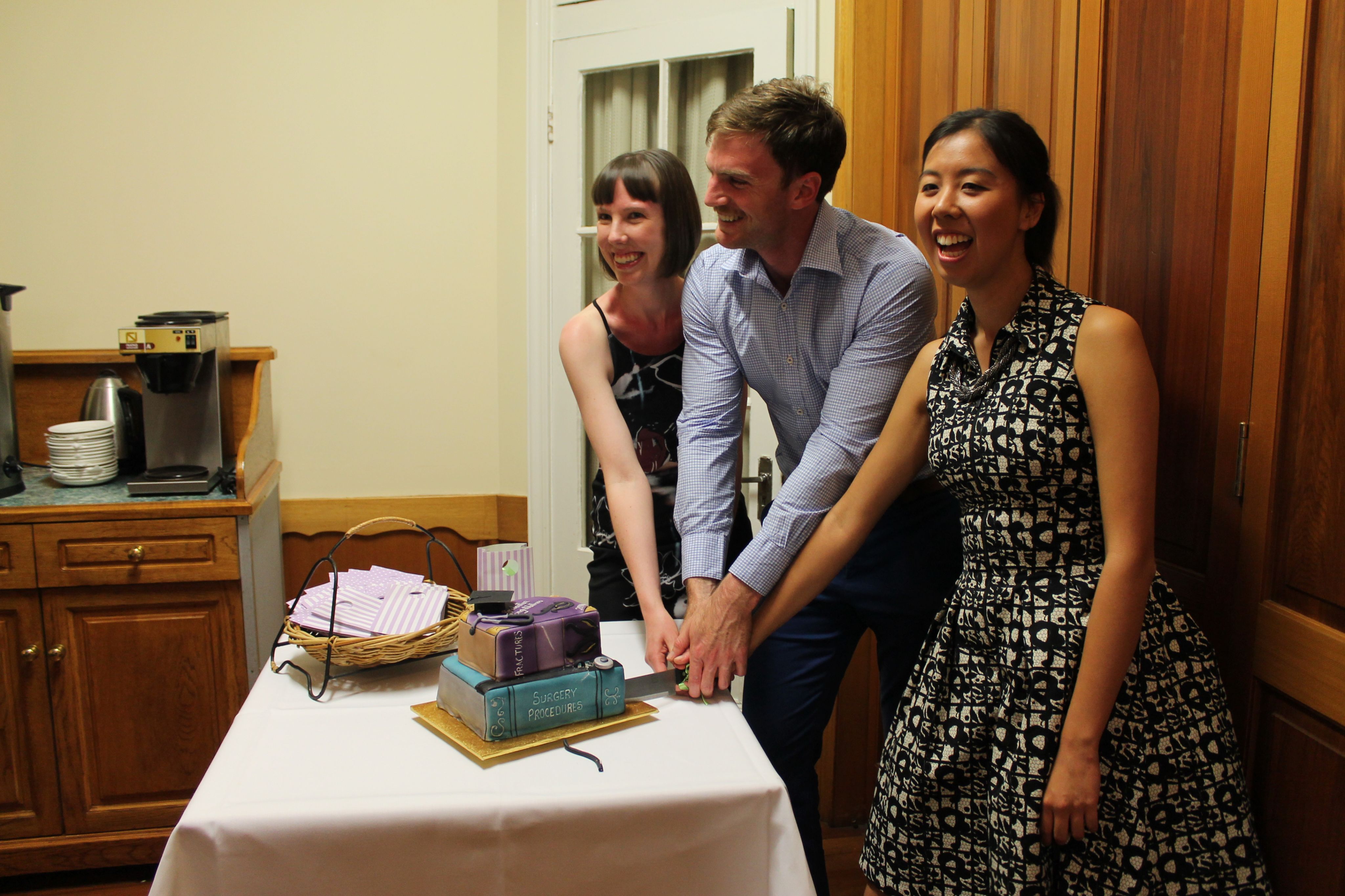 Cutting the cake at the 4th year dinner, 2014.