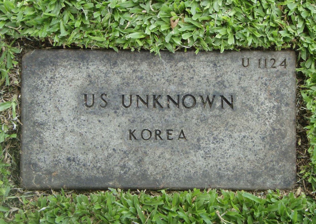 A head stone of an unknown US soldier from the National Memorial Cemetery of the Pacific (NMCP) in Hawaii. These headstones are in effect being replaced with names as chest radiograph identification methods are used to help identify them.