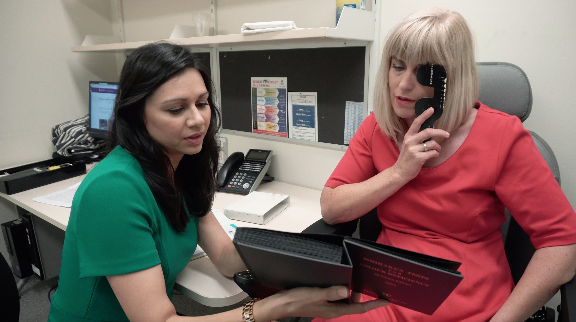 doctor consults with patient.