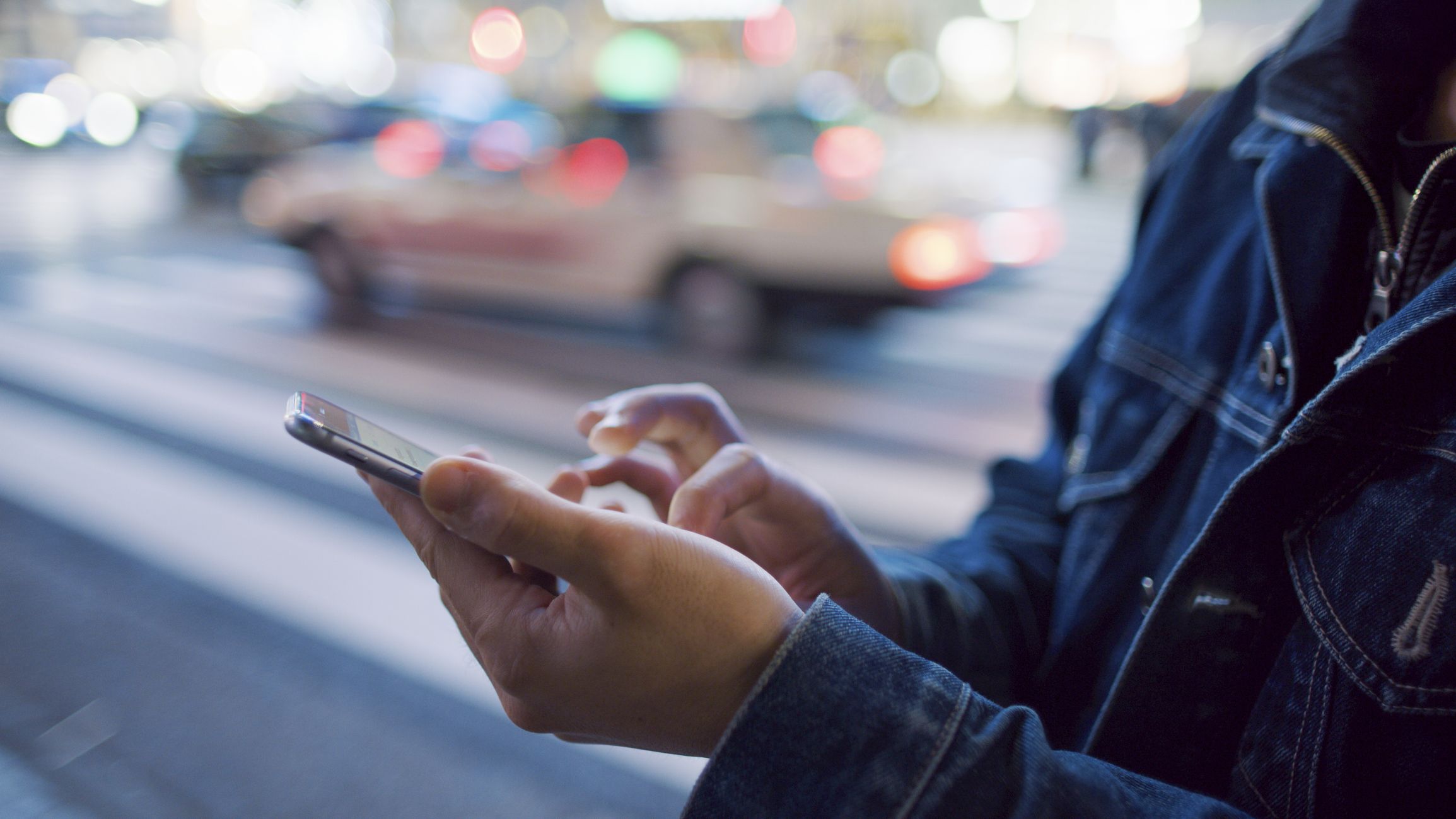 Person texting on phone in the city