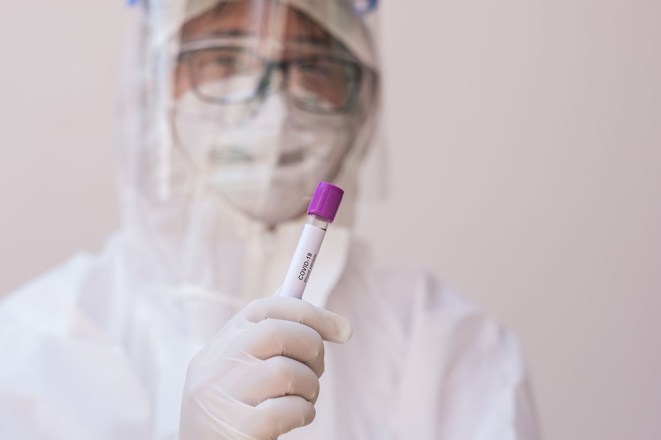 Doctor holding coronavirus blood sample