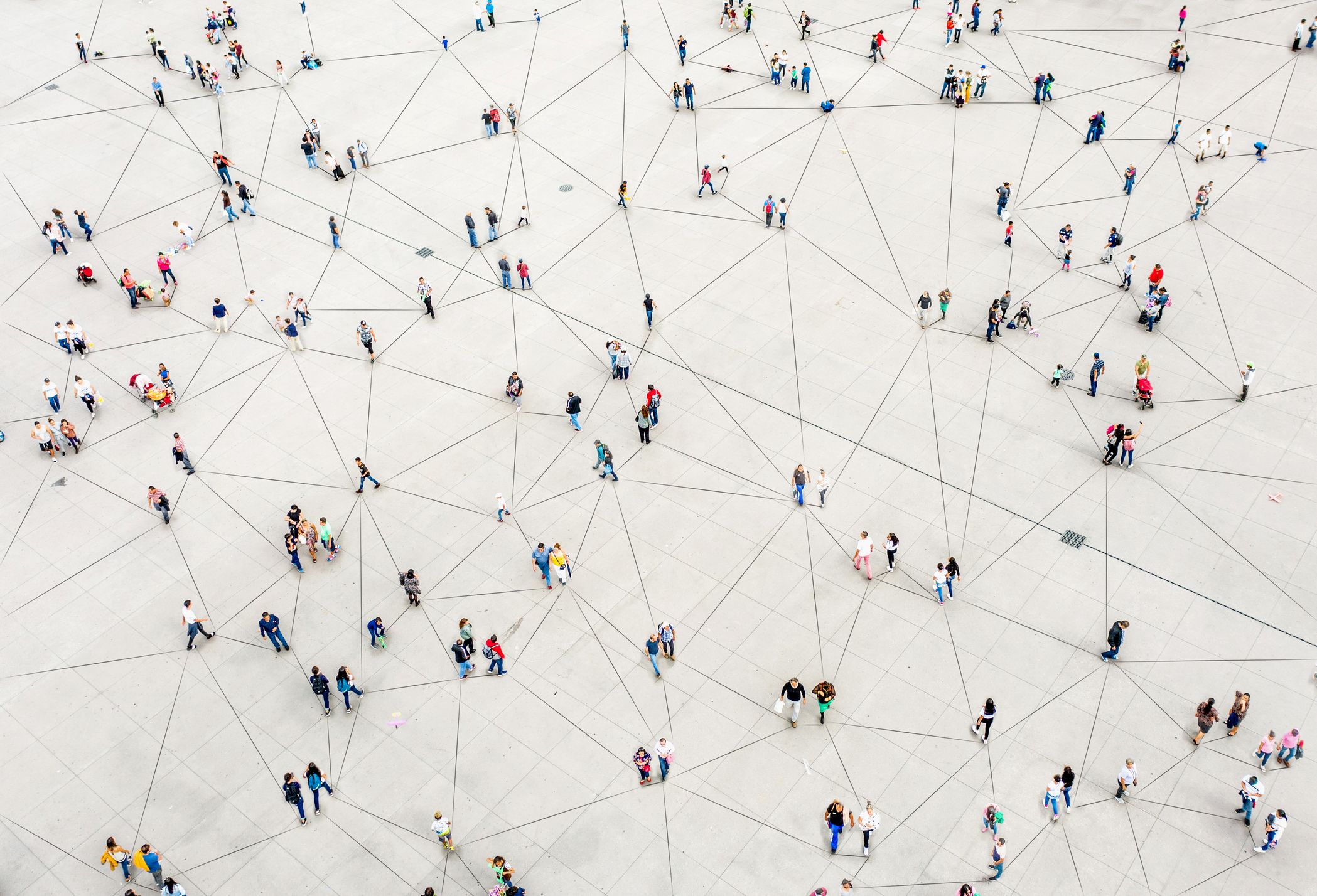 People walking across a white grid.