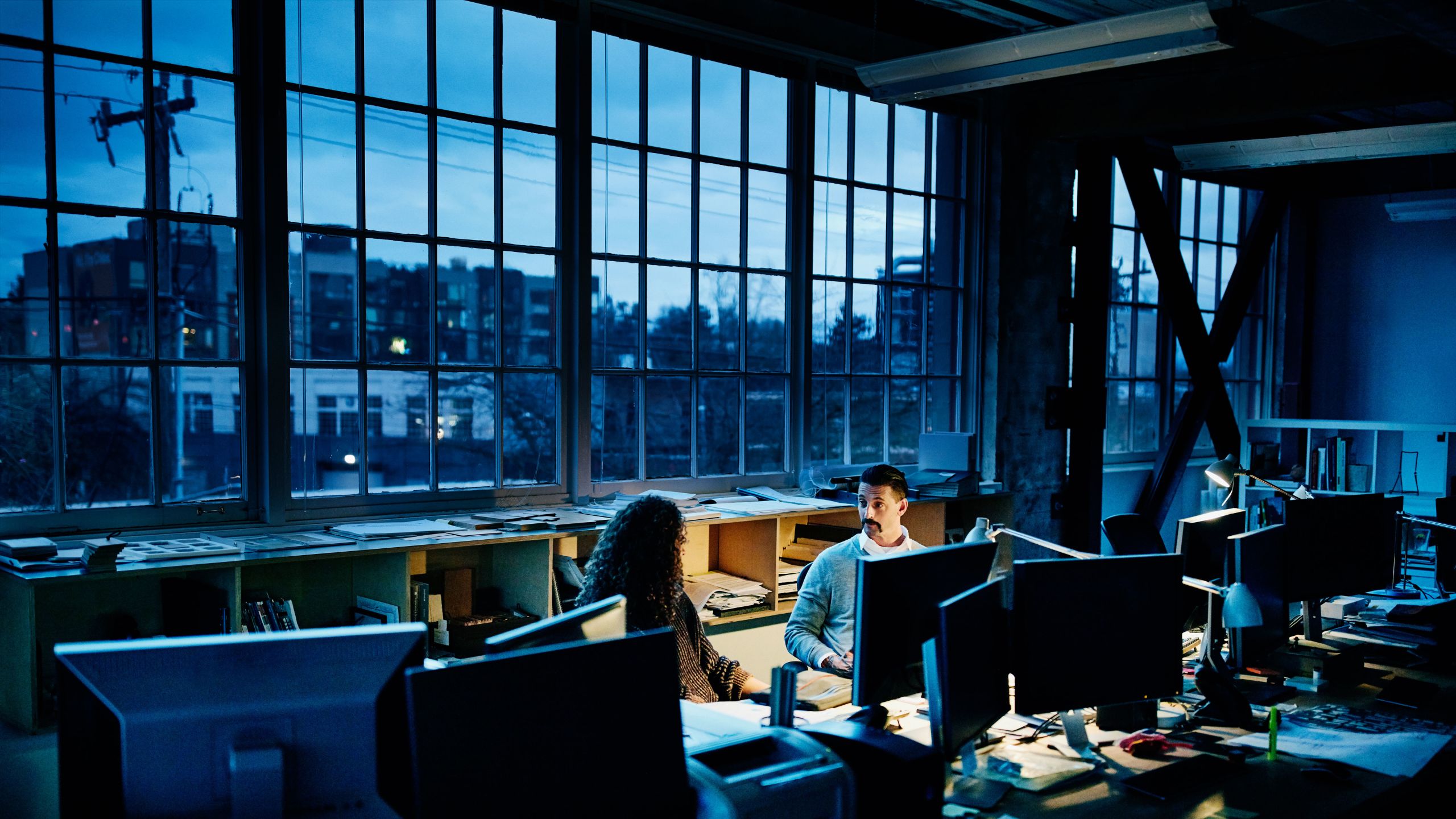two employees at a spinout office discussing a deep tech project