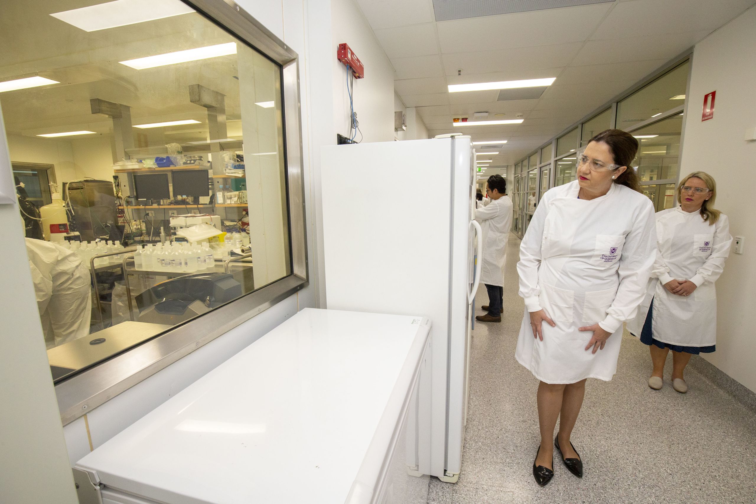 Members of Parliament look into the research lab where COVID-19 vaccine is being developed