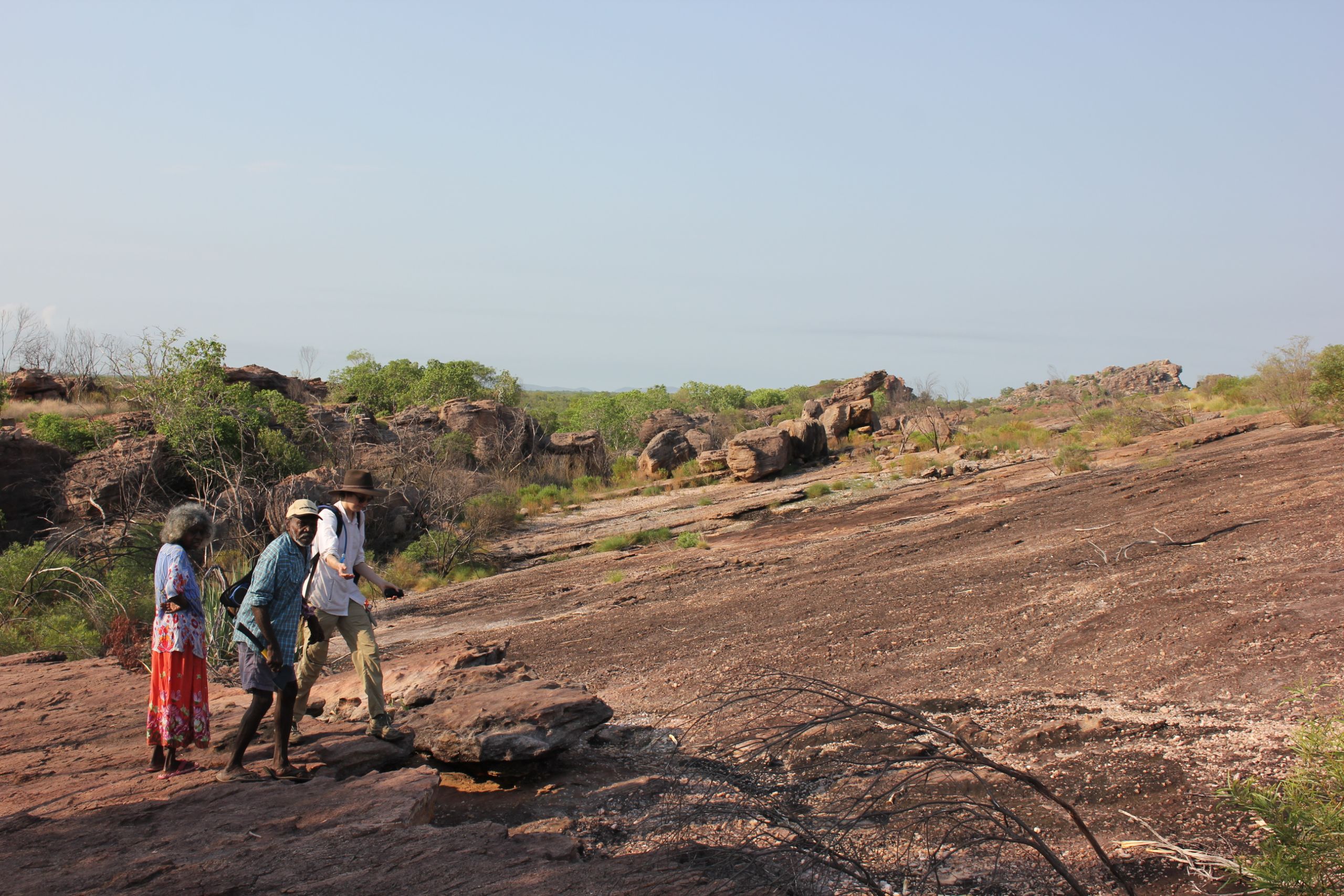 Elders at Madjedbebe archaeological site with a UQ researcher