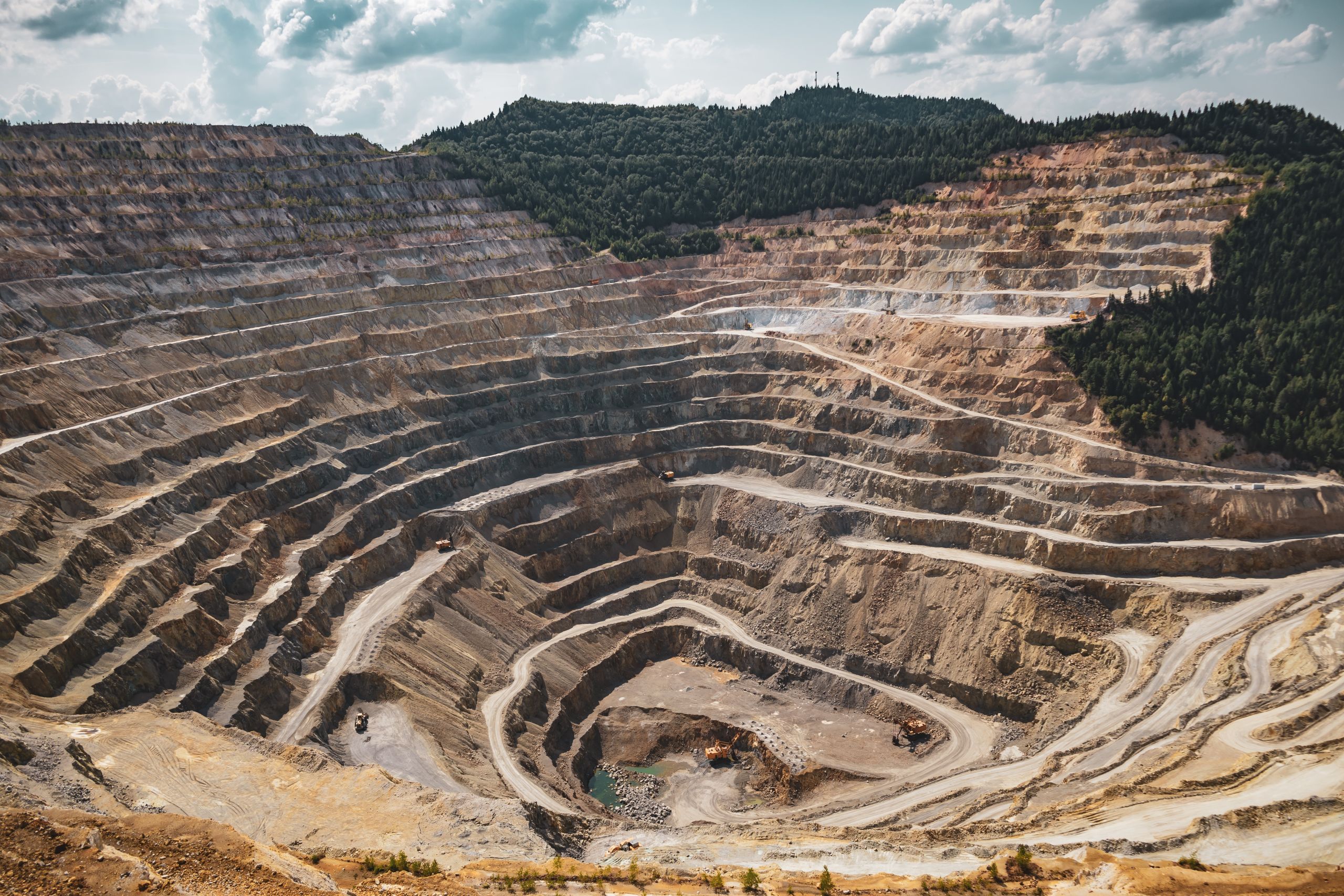 Graduated levels of cut outs in a circular pattern going down into a mine