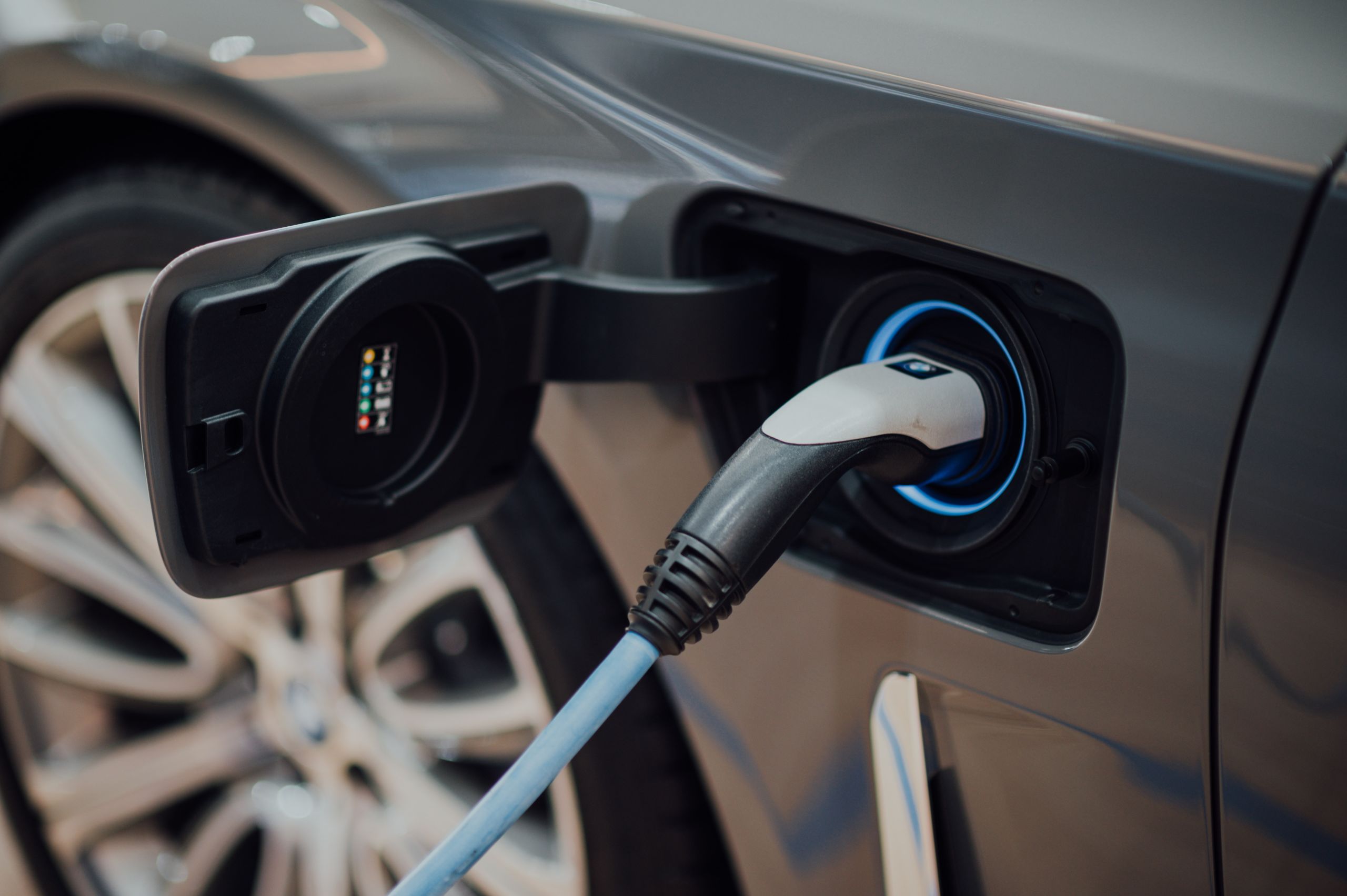 Electric car plug into socket in car