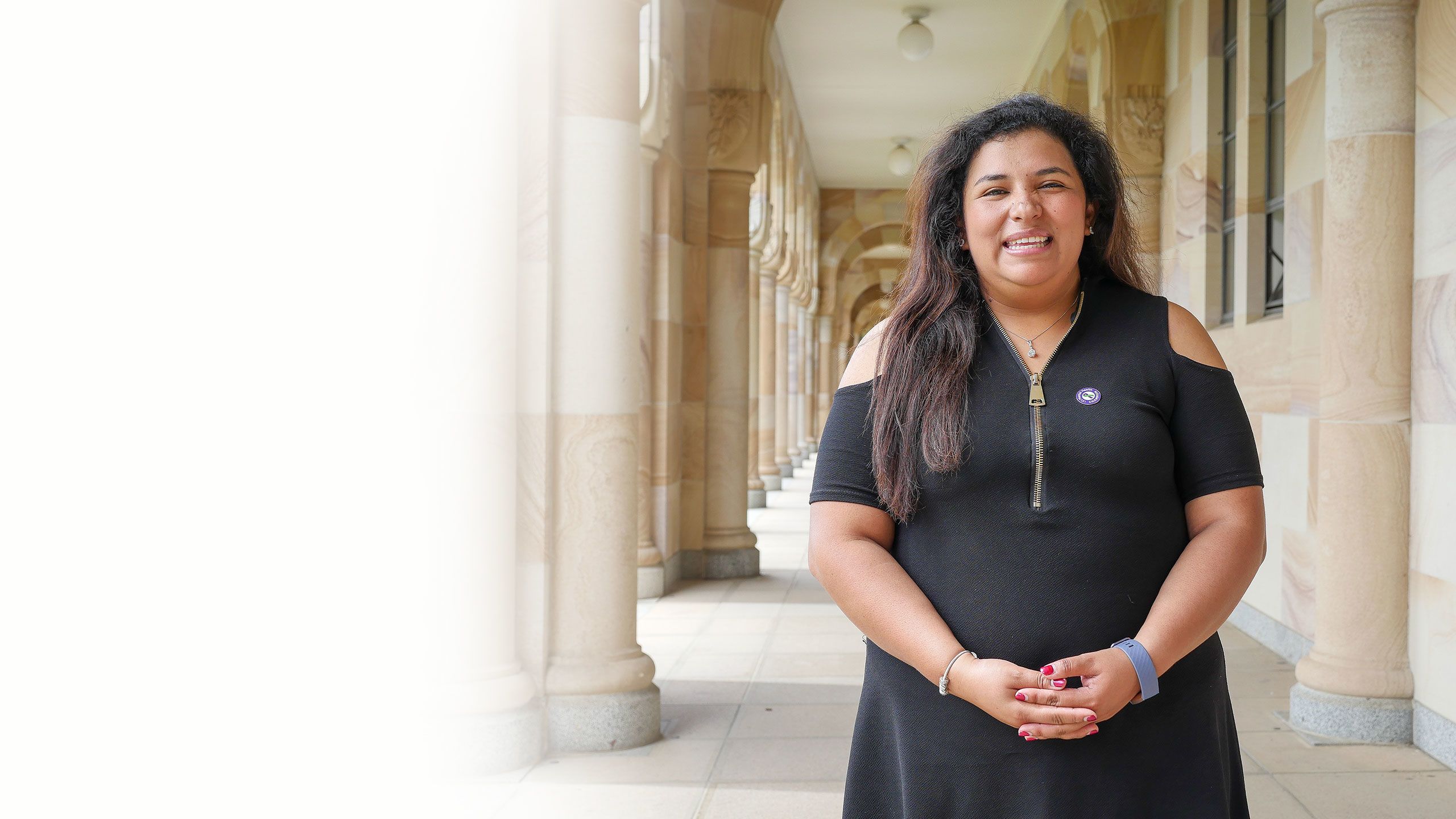 Staff and students photographed against UQ's sandstone buildings at the St Lucia campus.