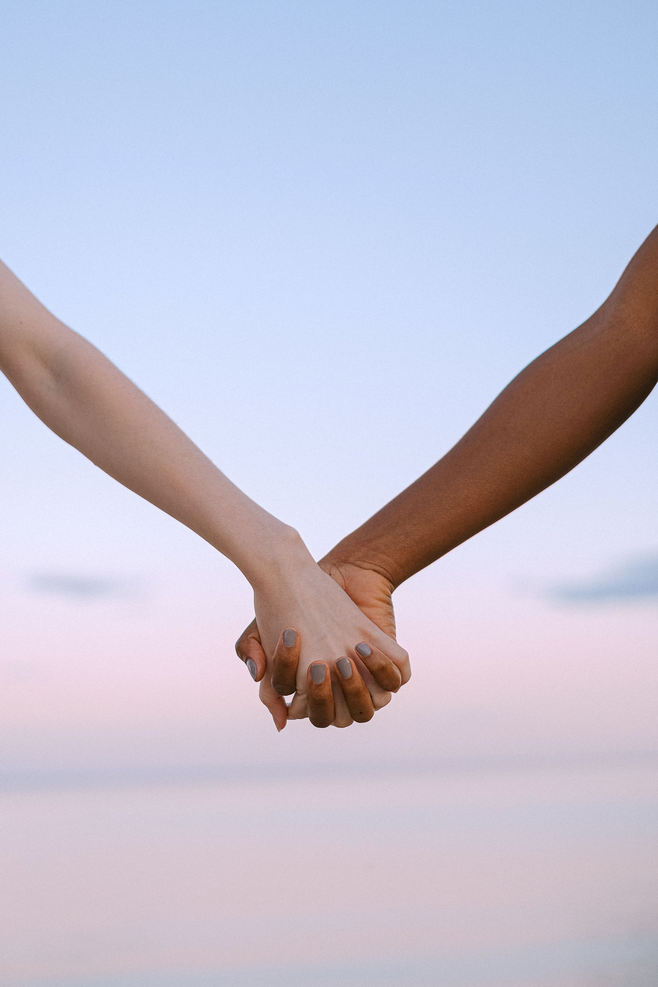 Stock image: Two people holding hands