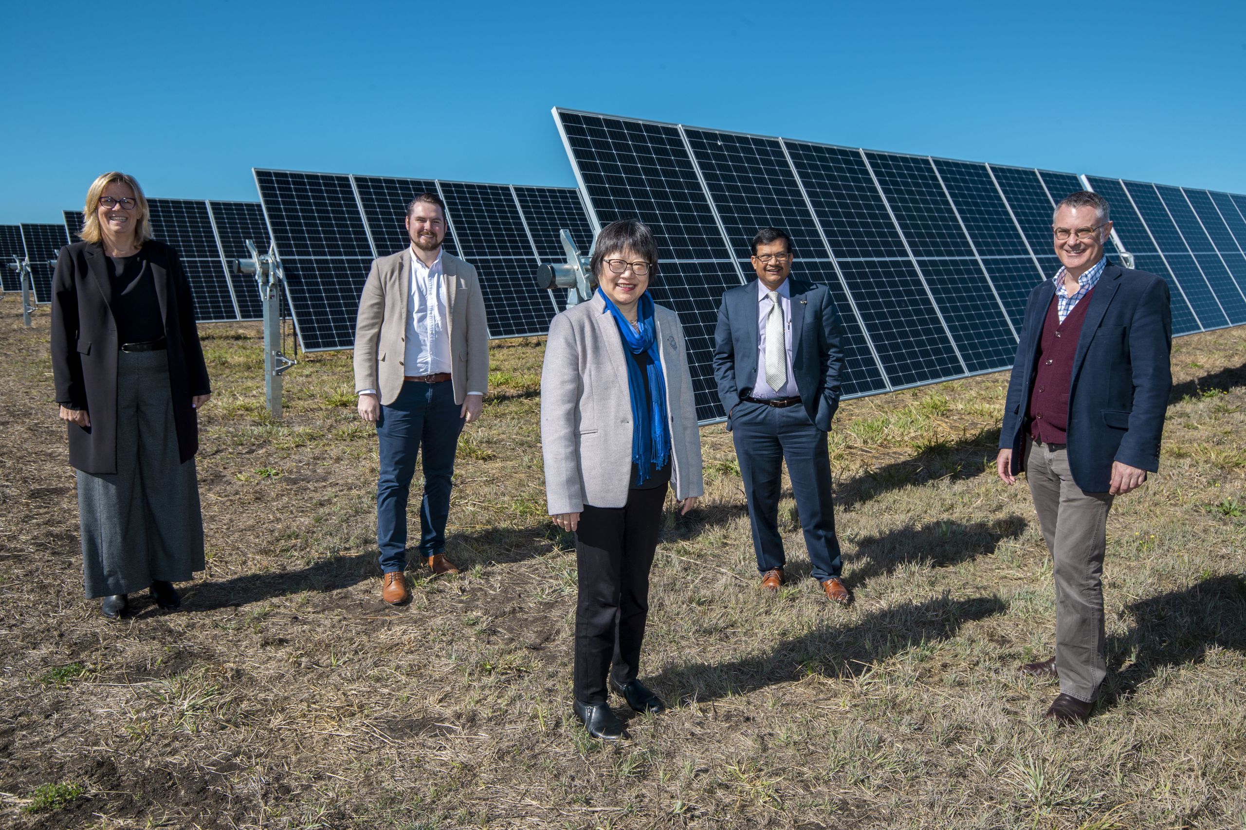(Left to Right) UQ Chair in Sustainable Energy Futures Professor Peta Ashworth, Dr Jake Whitehead, Faculty of Engineering, Architecture and Information Technology Executive Dean Professor Vicki Chen, Professor Tapan Saha and Professor Stephen Wilson standing in front of solar panels at UQ's Warwick Solar Farm.