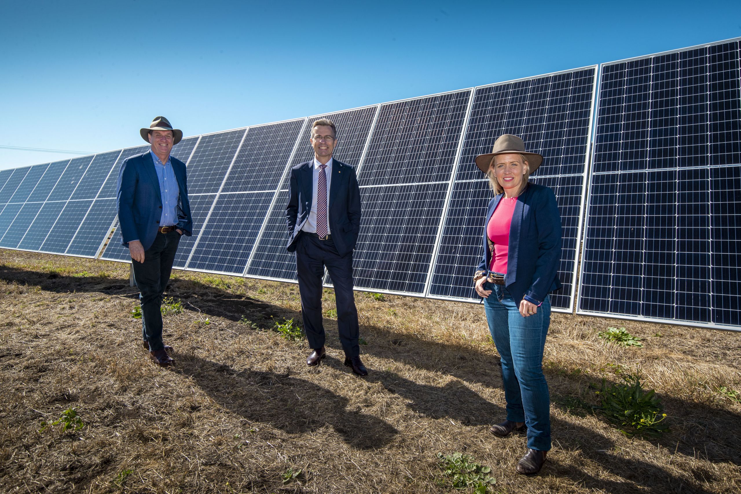 Minister for Natural Resources, Mines and Energy Anthony Lynham, UQ Vice-Chancellor Professor Peter Høj and Minister for State Development, Tourism and innovation Kate Jones at Warwick standing in front of solar panels.