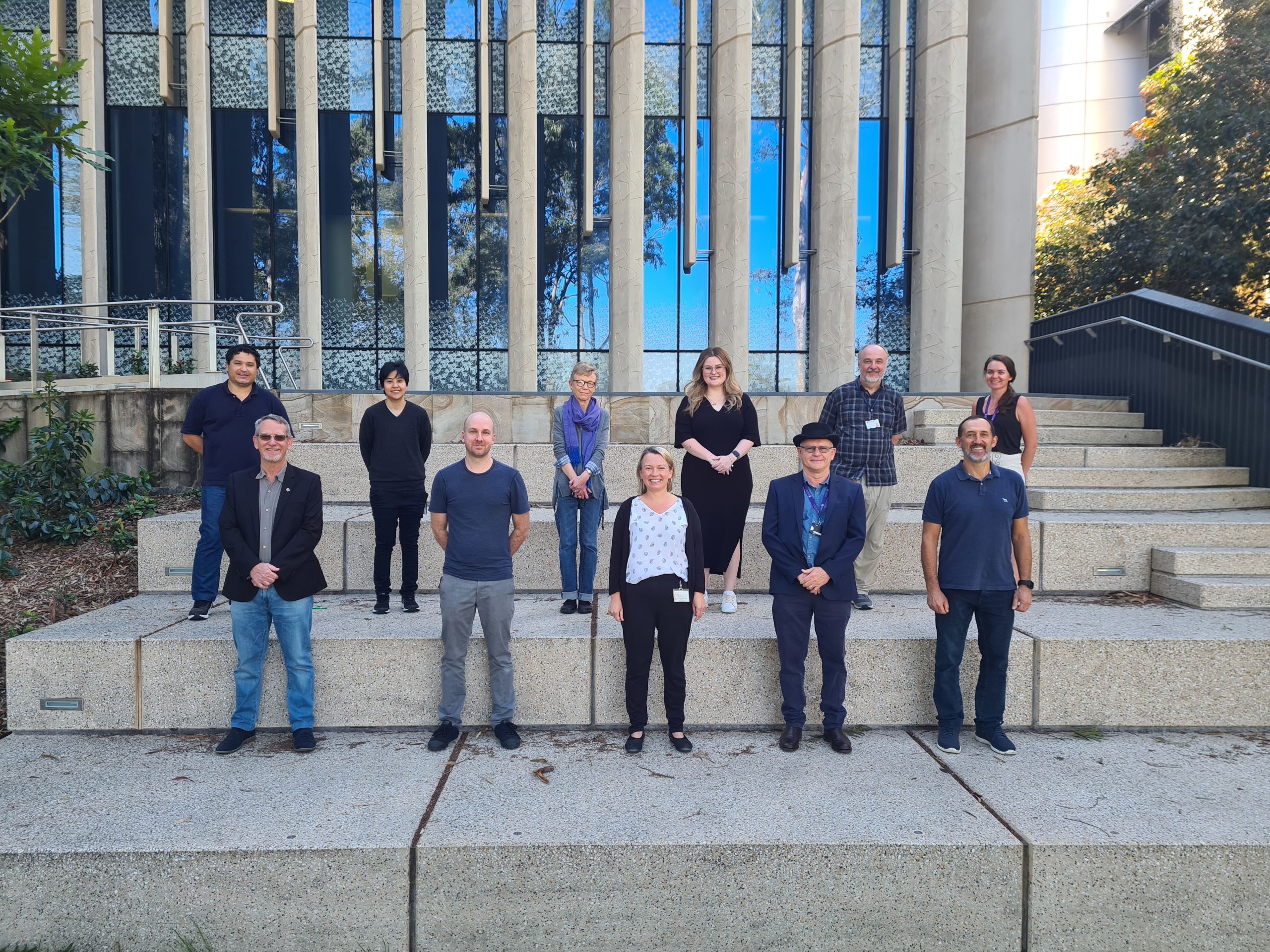 Team Chimera standing socially distanced on steps at UQ