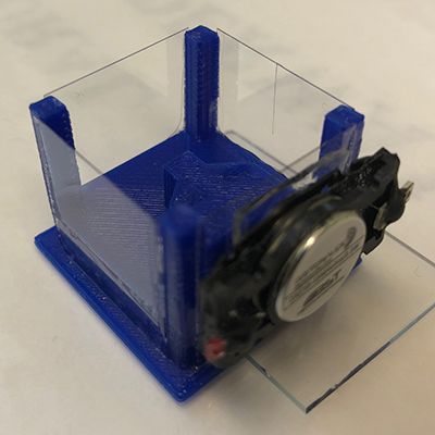 A chamber holding zebrafish with audio attachment.