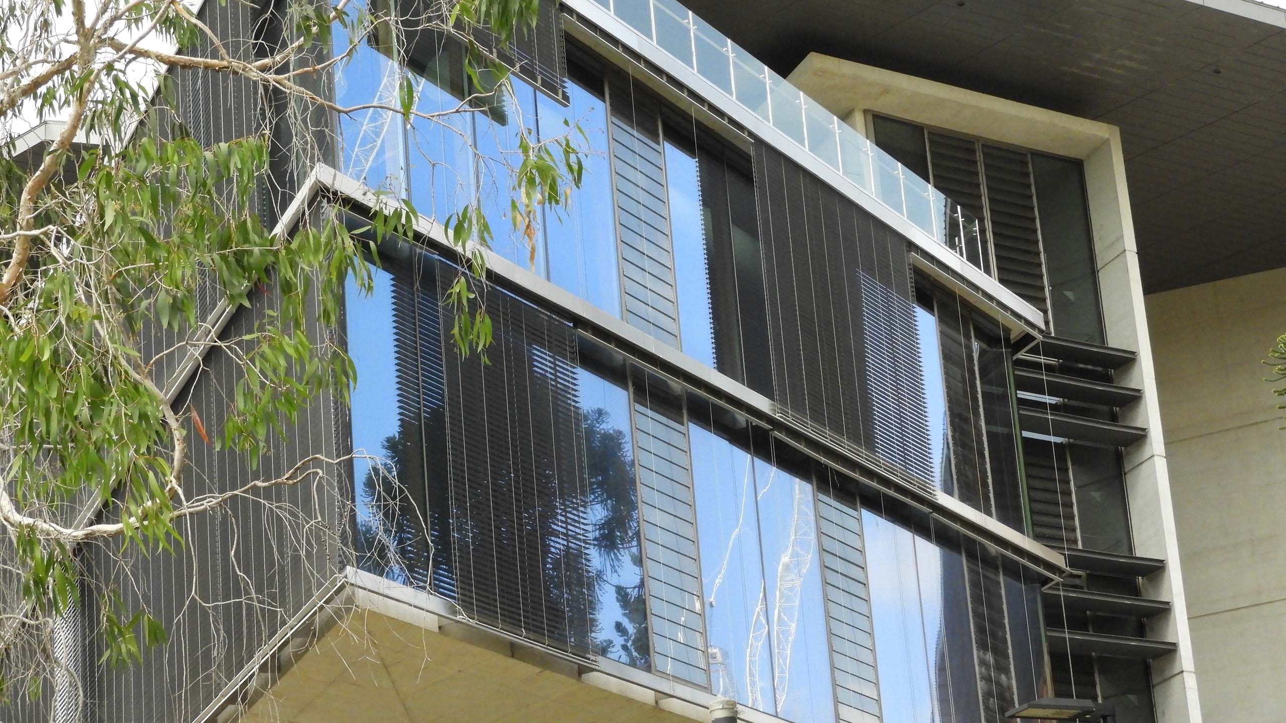 Reflective windows of Advanced Engineering building with sky visible
