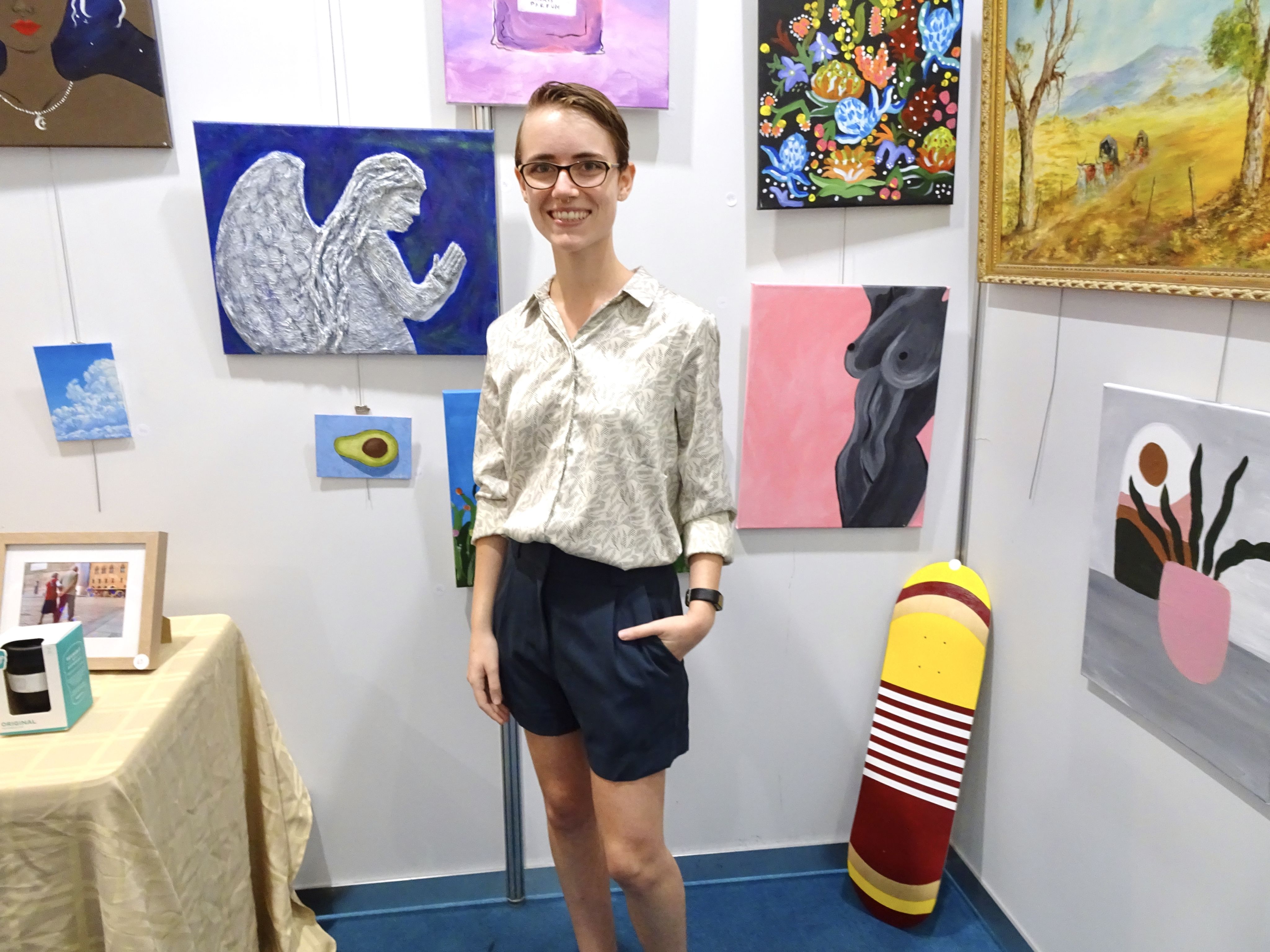 Alex Bradford standing amid various artistic words