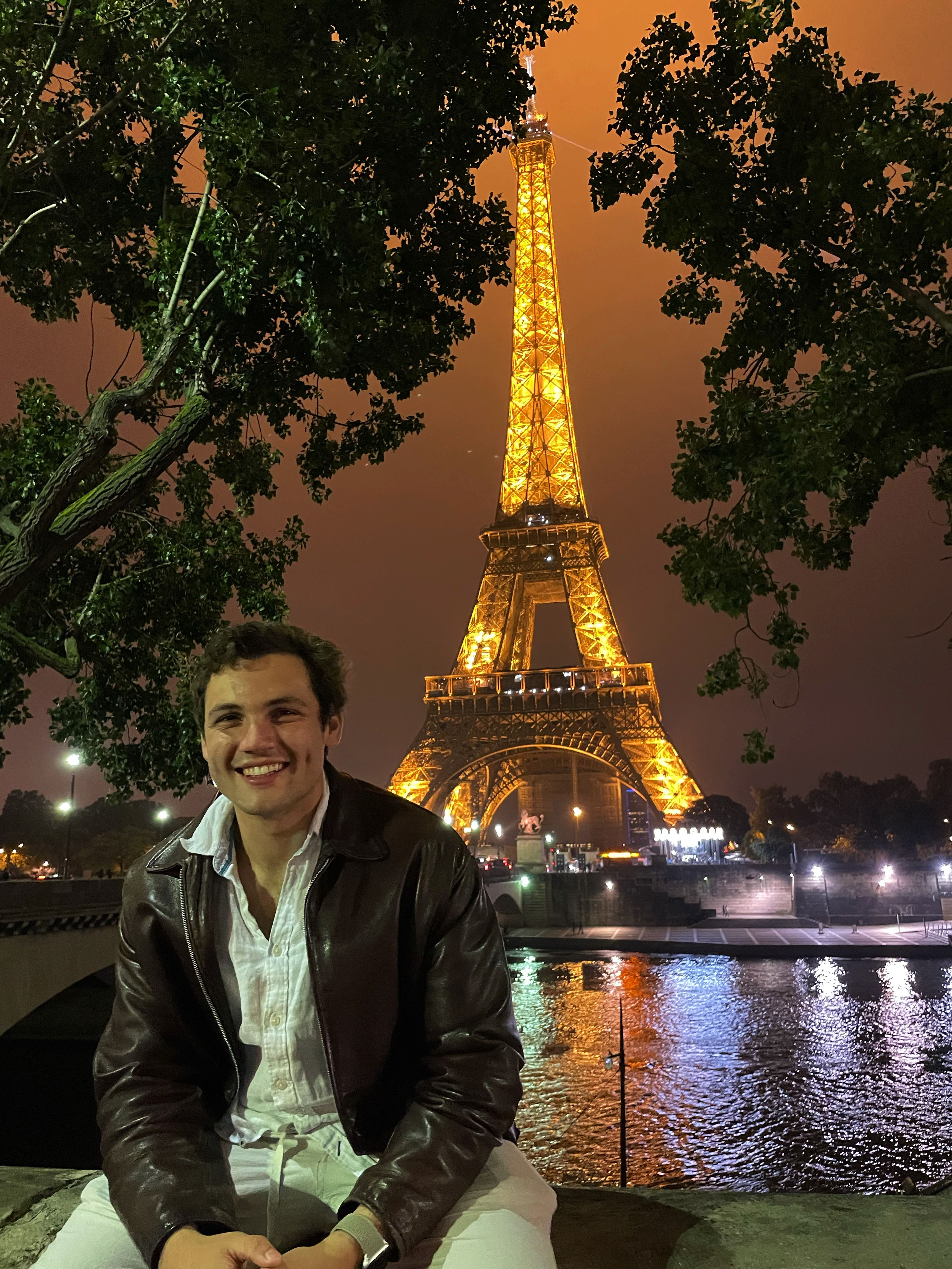 William sitting in Trocadero Square across from the Eiffel Tower