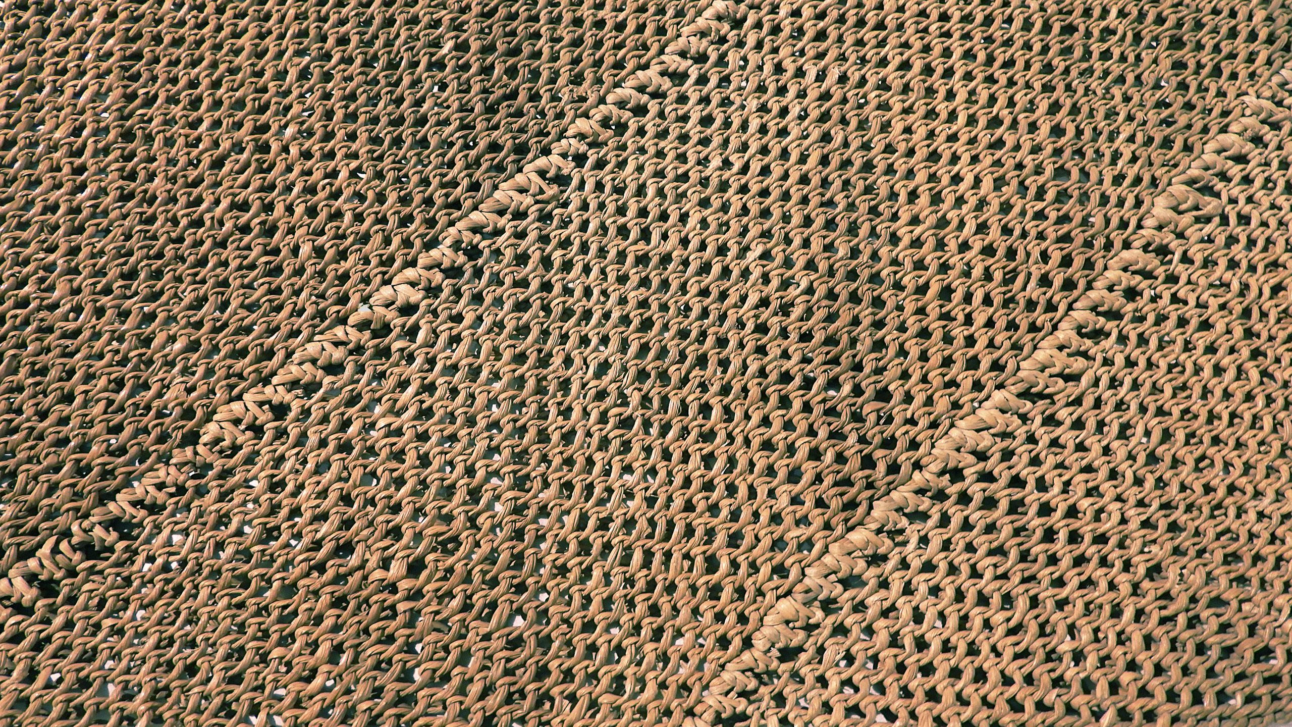 A closeup of a woven guleyi, made in the 1800s with a distinctive diagonal knot.