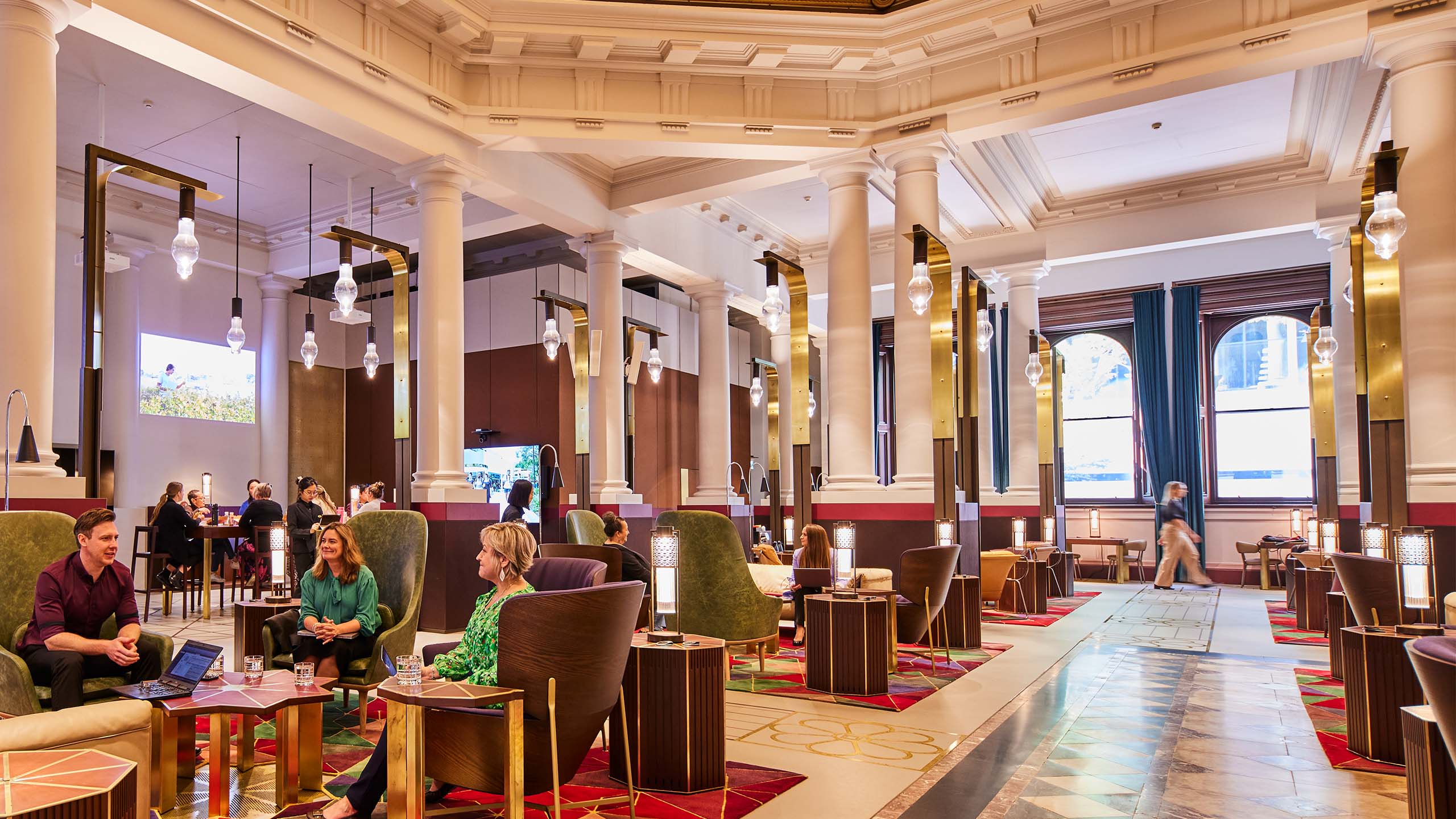 Inside the new UQ Brisbane City building with people having a meeting