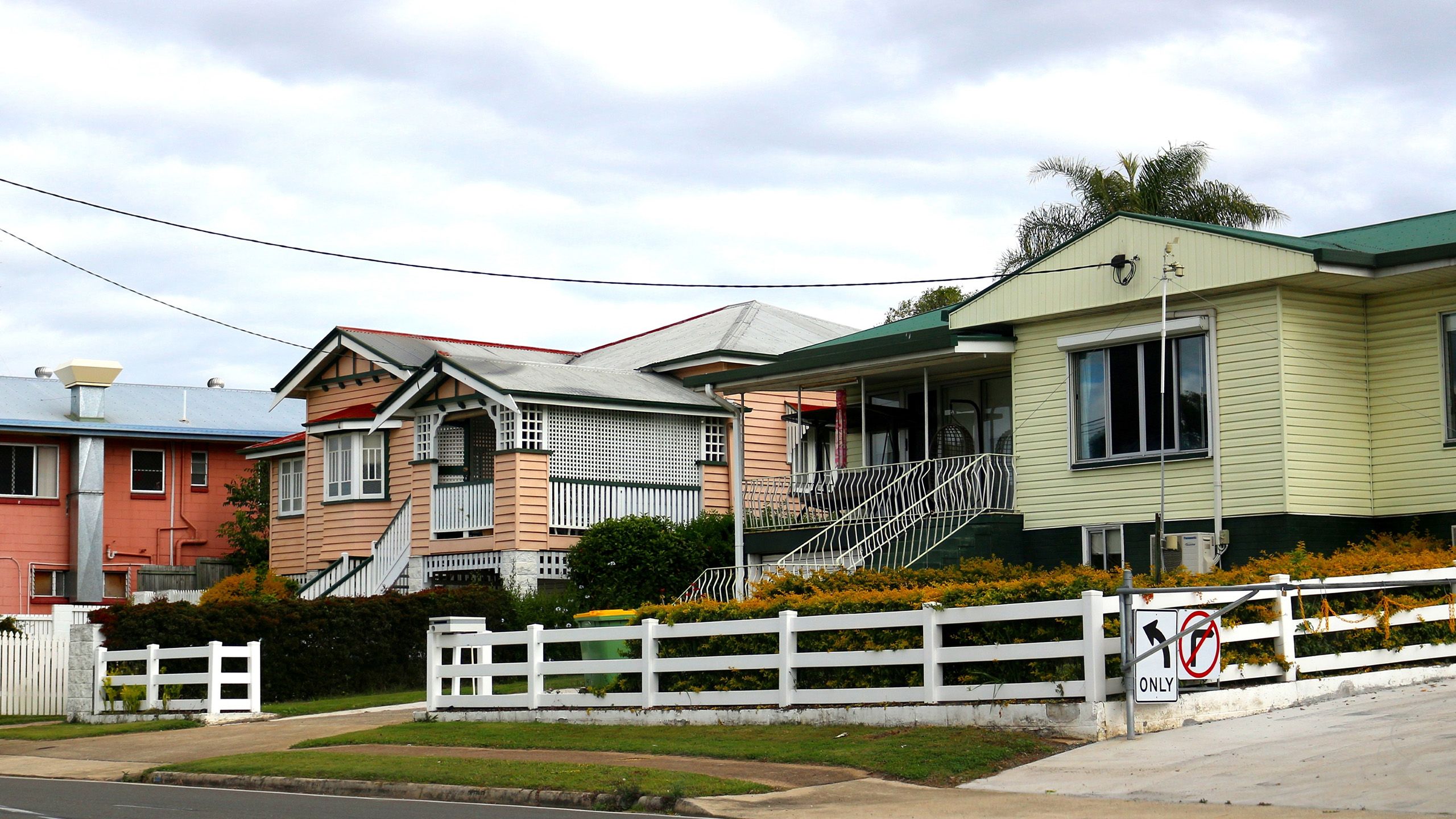 Old Queenslander houses on a suburban street