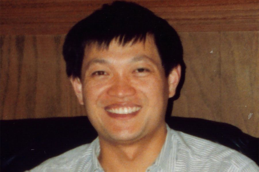 Dr Jian Zhou smiling broadly
