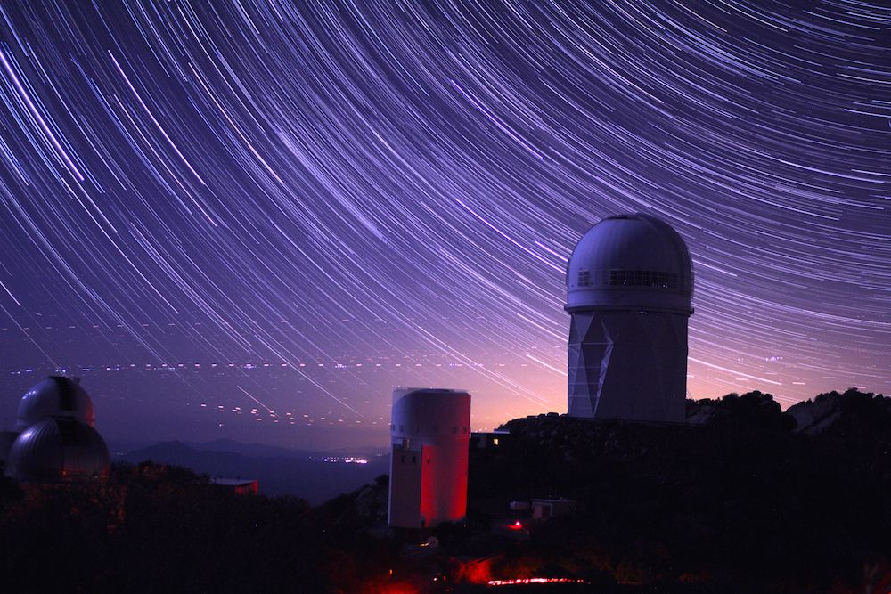 A long-exposure night sky shot of the stars above the telescope