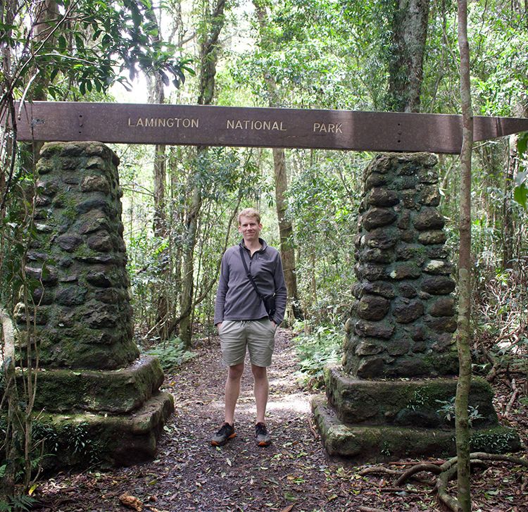 James Tweed in front of a national park sign.