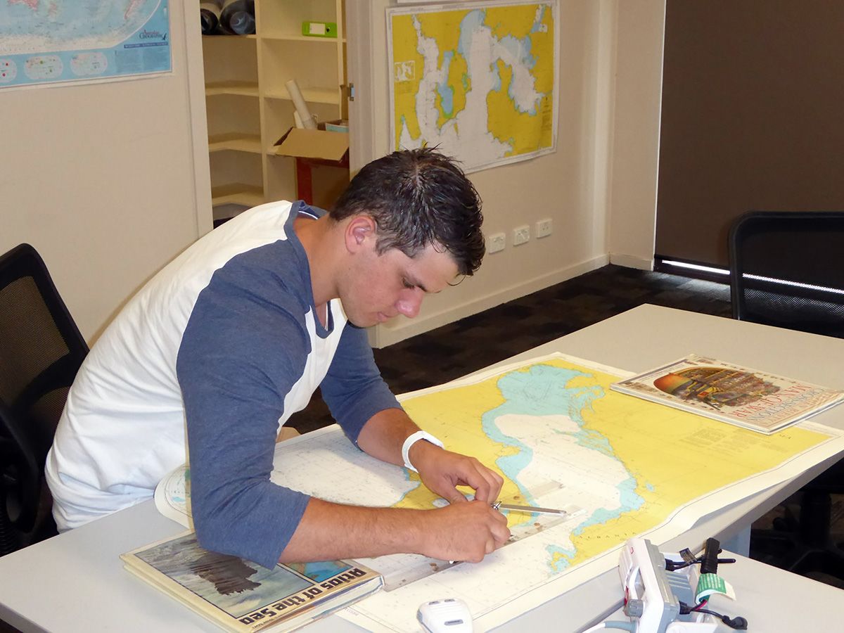 Purposeful learning: a student plotting a course in maritime operations (photo credit: S. Harrison).