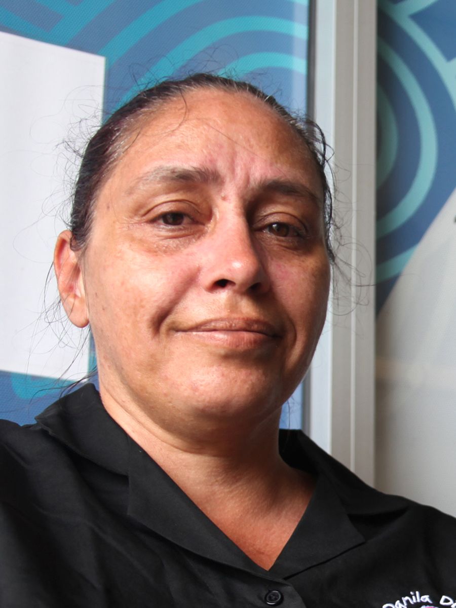 A headshot of Maida Stewart, a Wemba Wemba/Wergaia woman, wearing a dark-coloured polo shirt