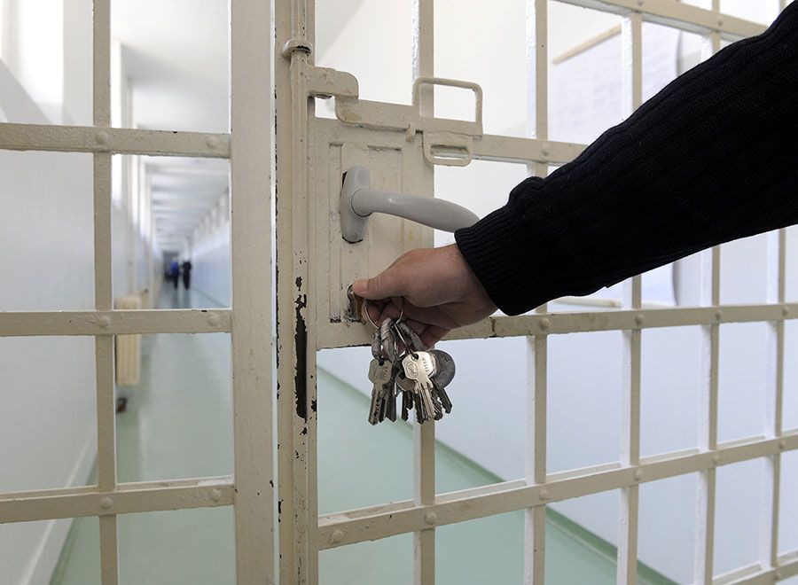 An image of a person locking a cell.
