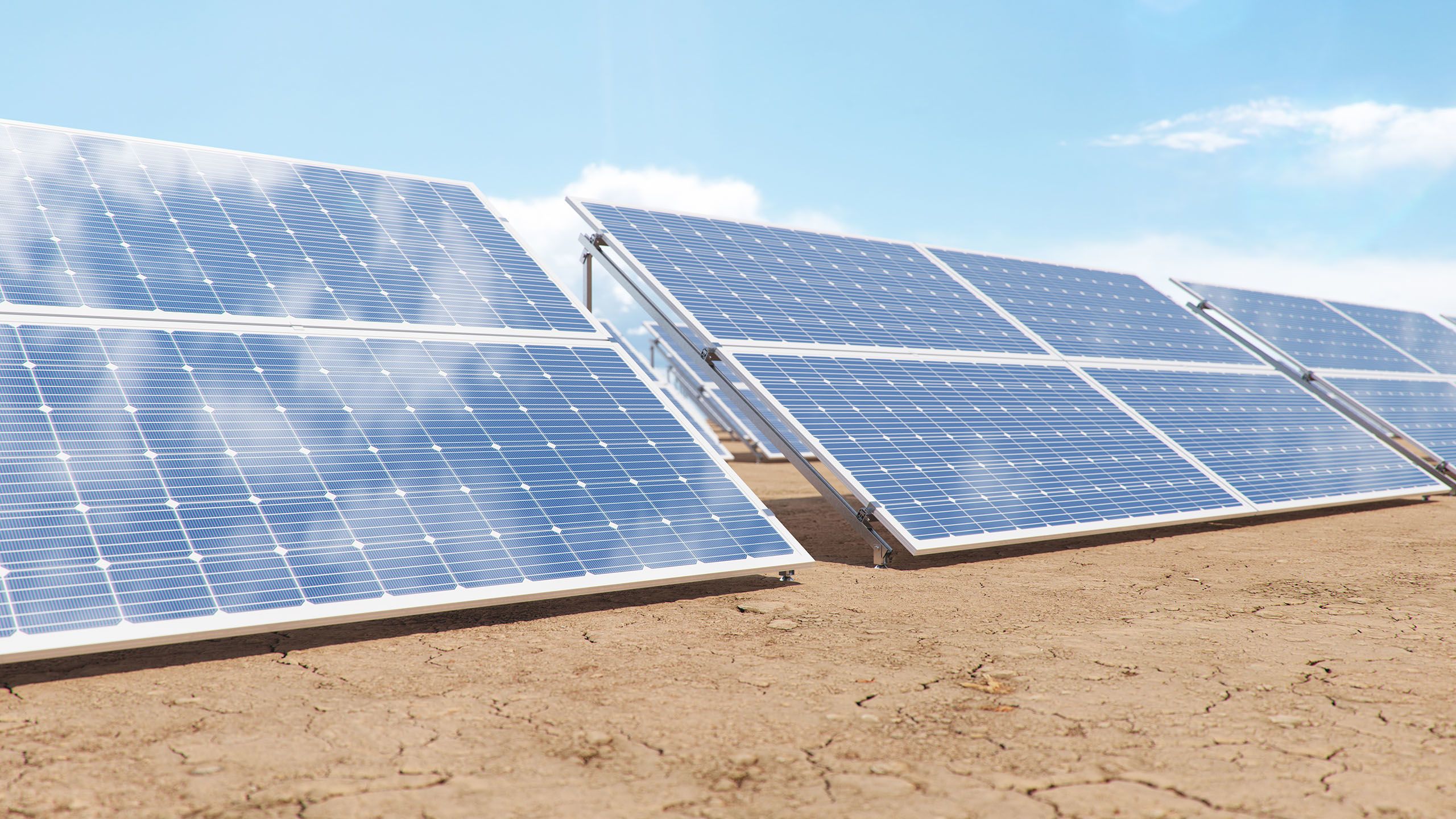 Photovoltaic solar panels, with reflection of a blue sky.