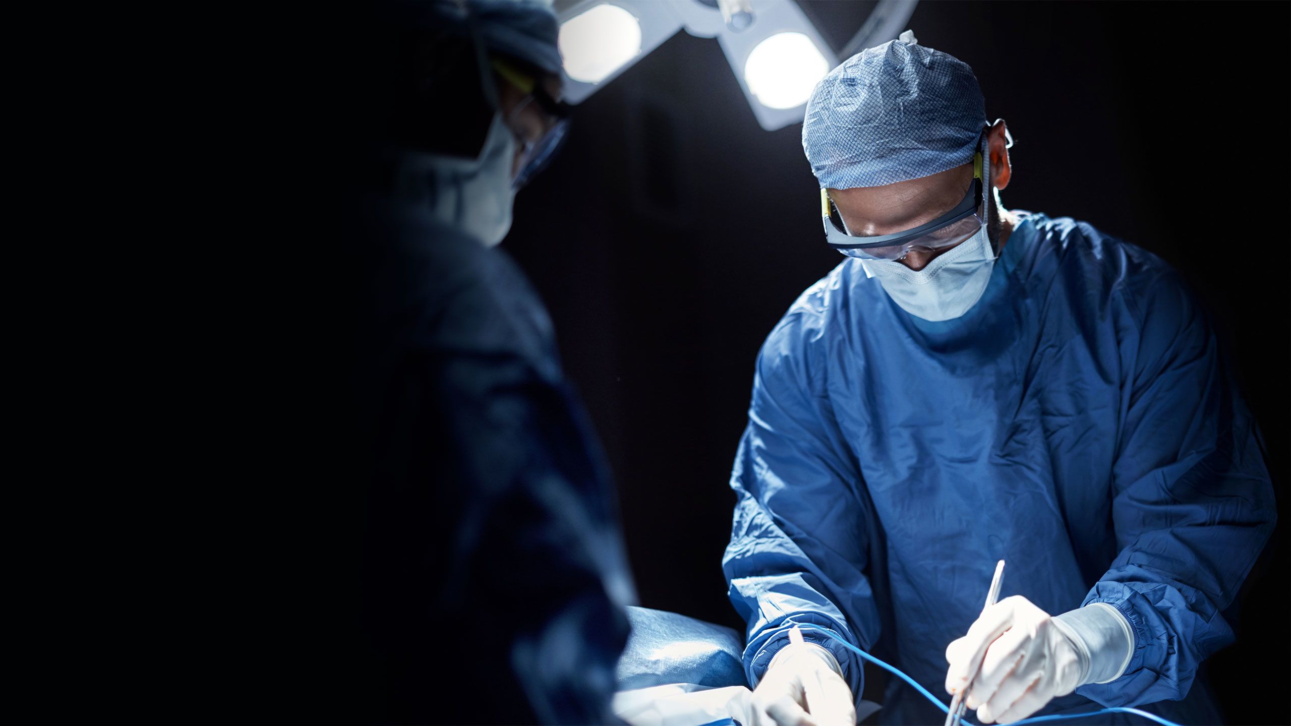 An image of a surgeon operating.