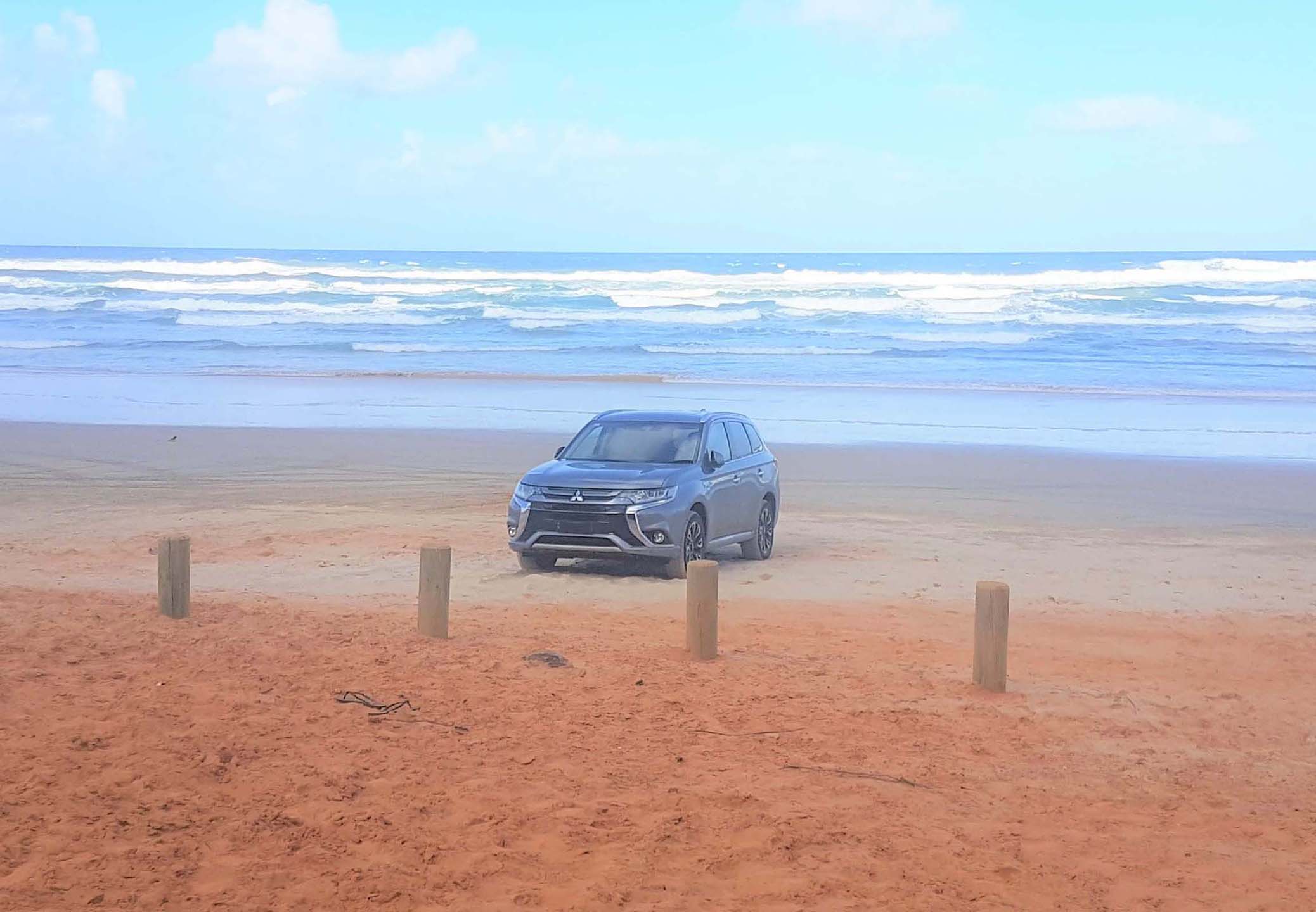 A four-wheel drive EV on the beach
