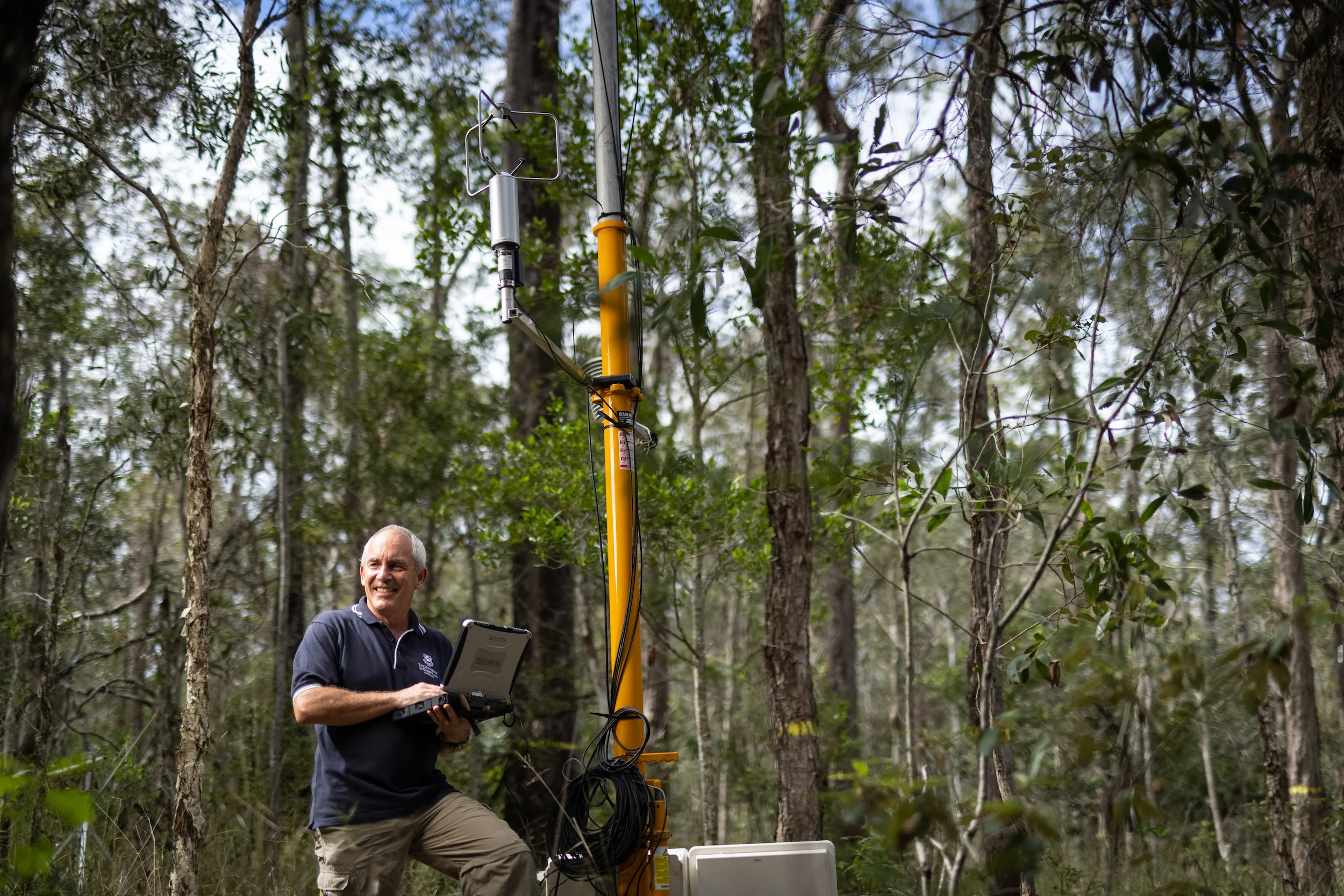 Professor Hamish McGowan with a mobile weather station.