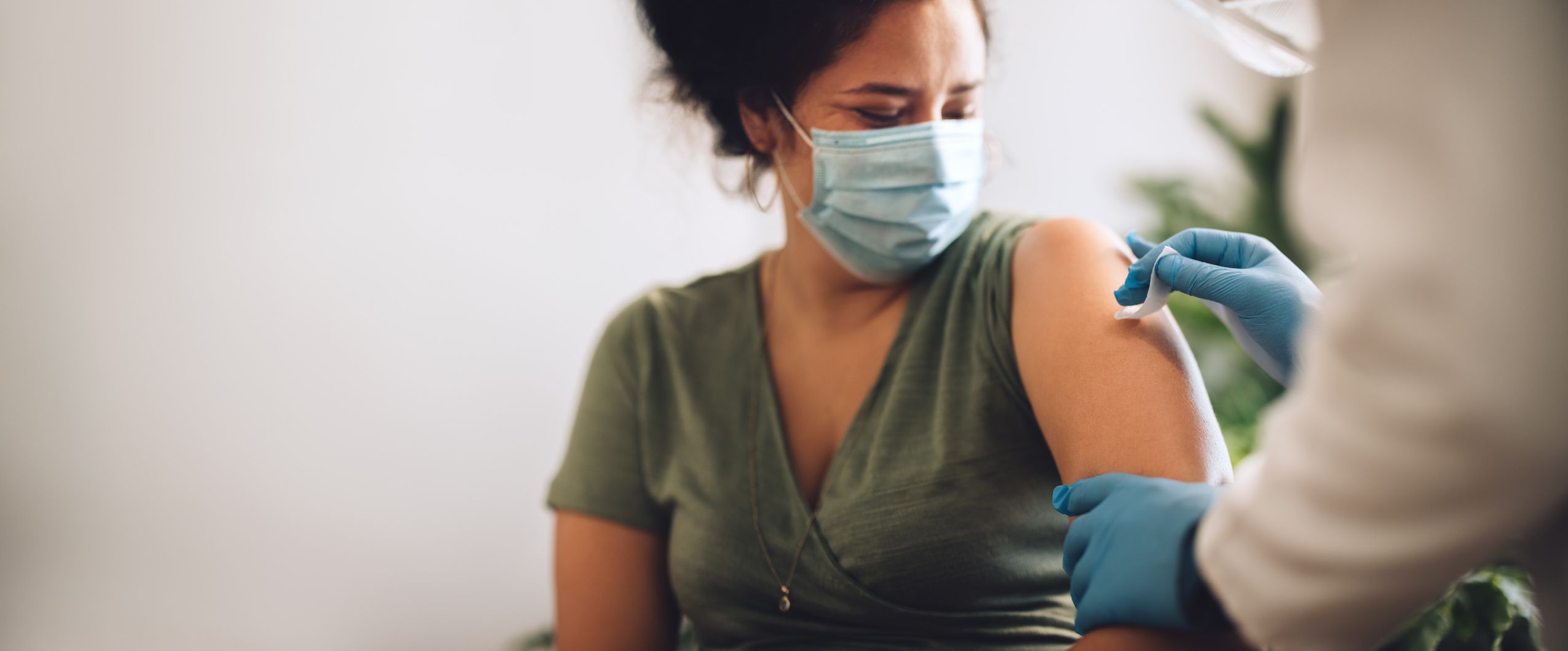 A woman receiving a COVID-19 vaccination.