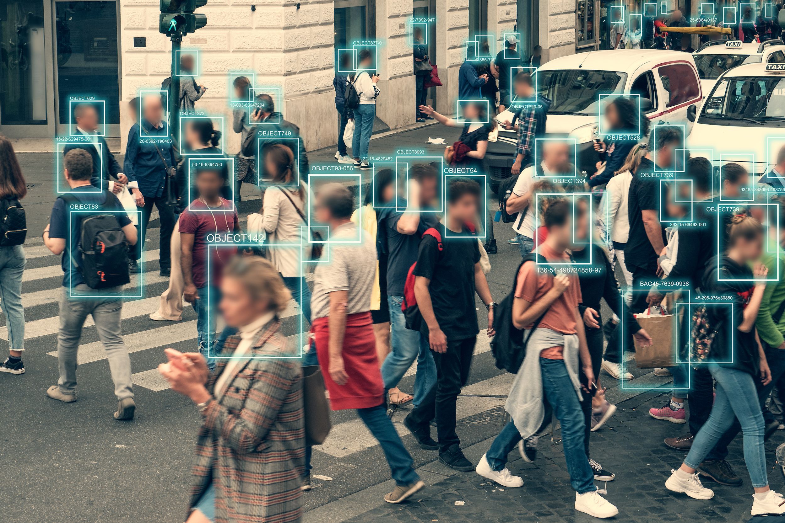 A concept of facial detection and recognition on a city street.