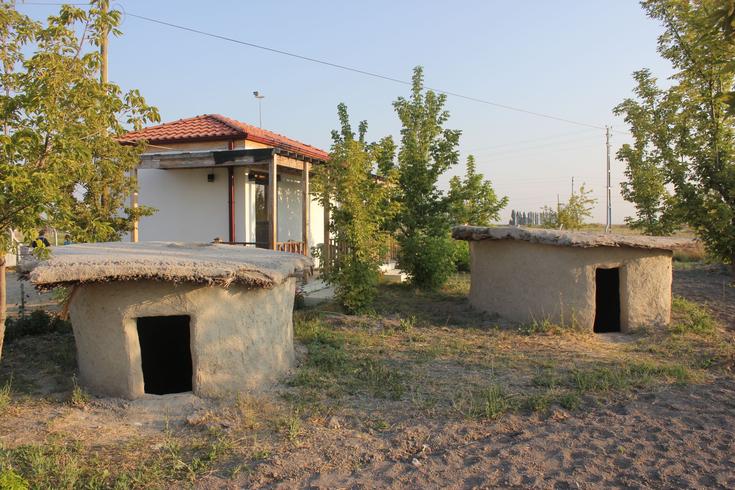 Two reconstructed Neolithic mud brick huts