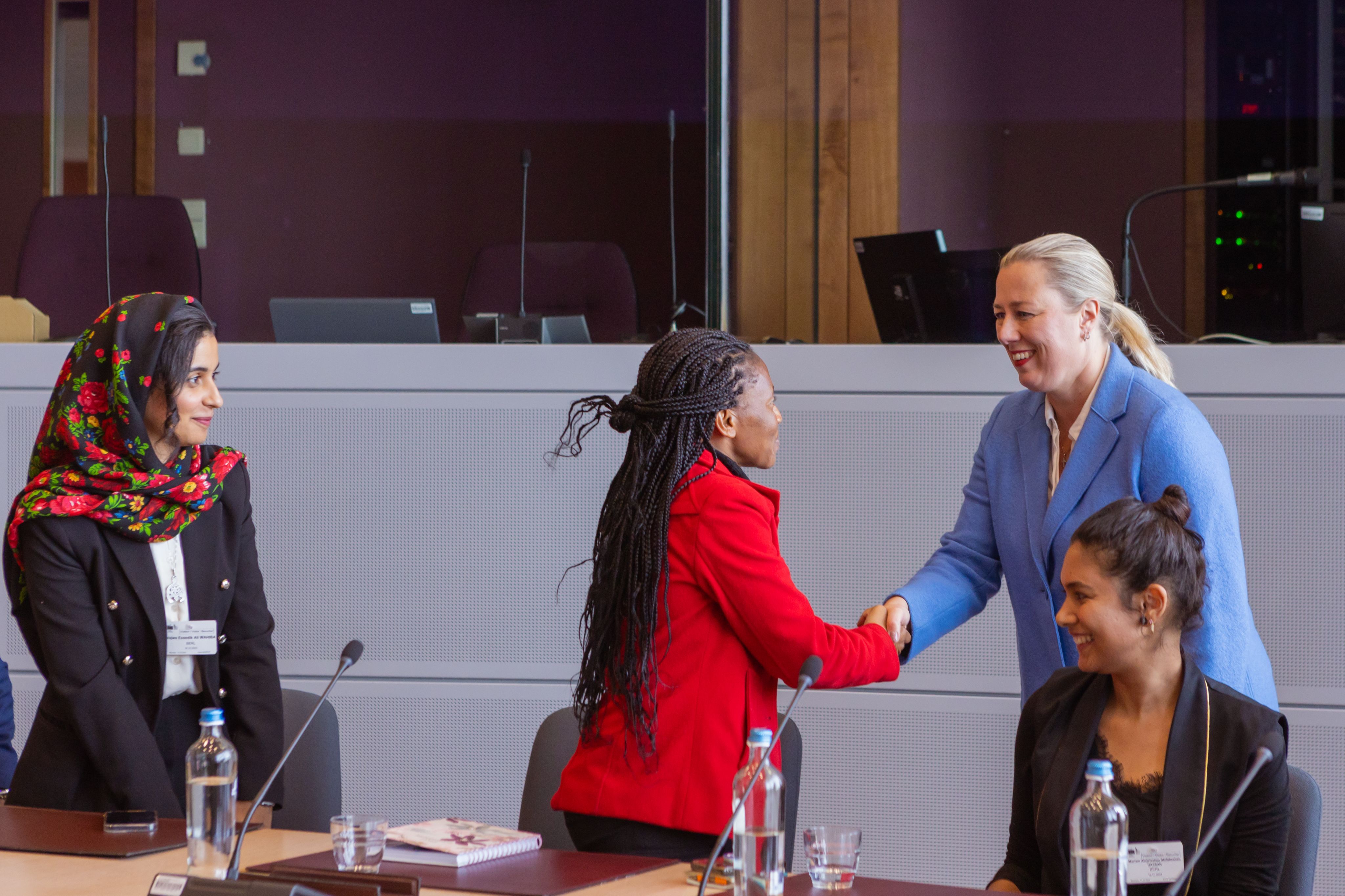 Linus greeting the European Commissioner of International Partnerships in Brussels, Germany.