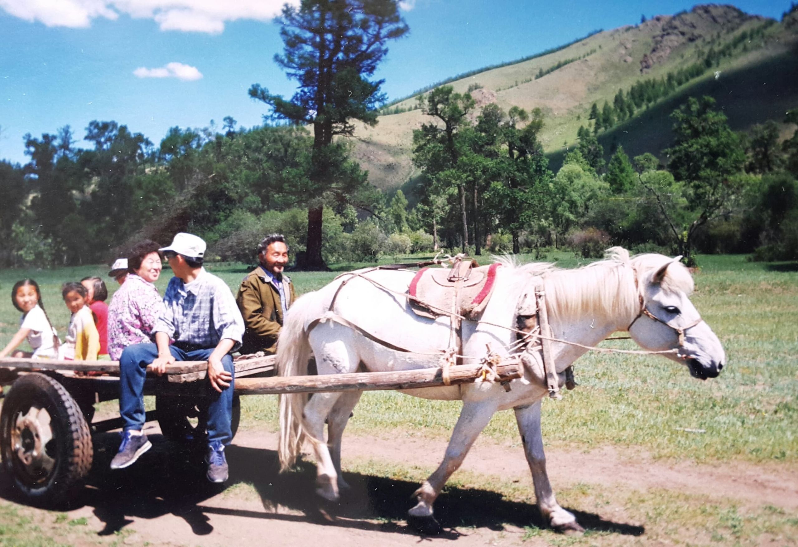 Saka's family sitting on a horse-drawn cart.