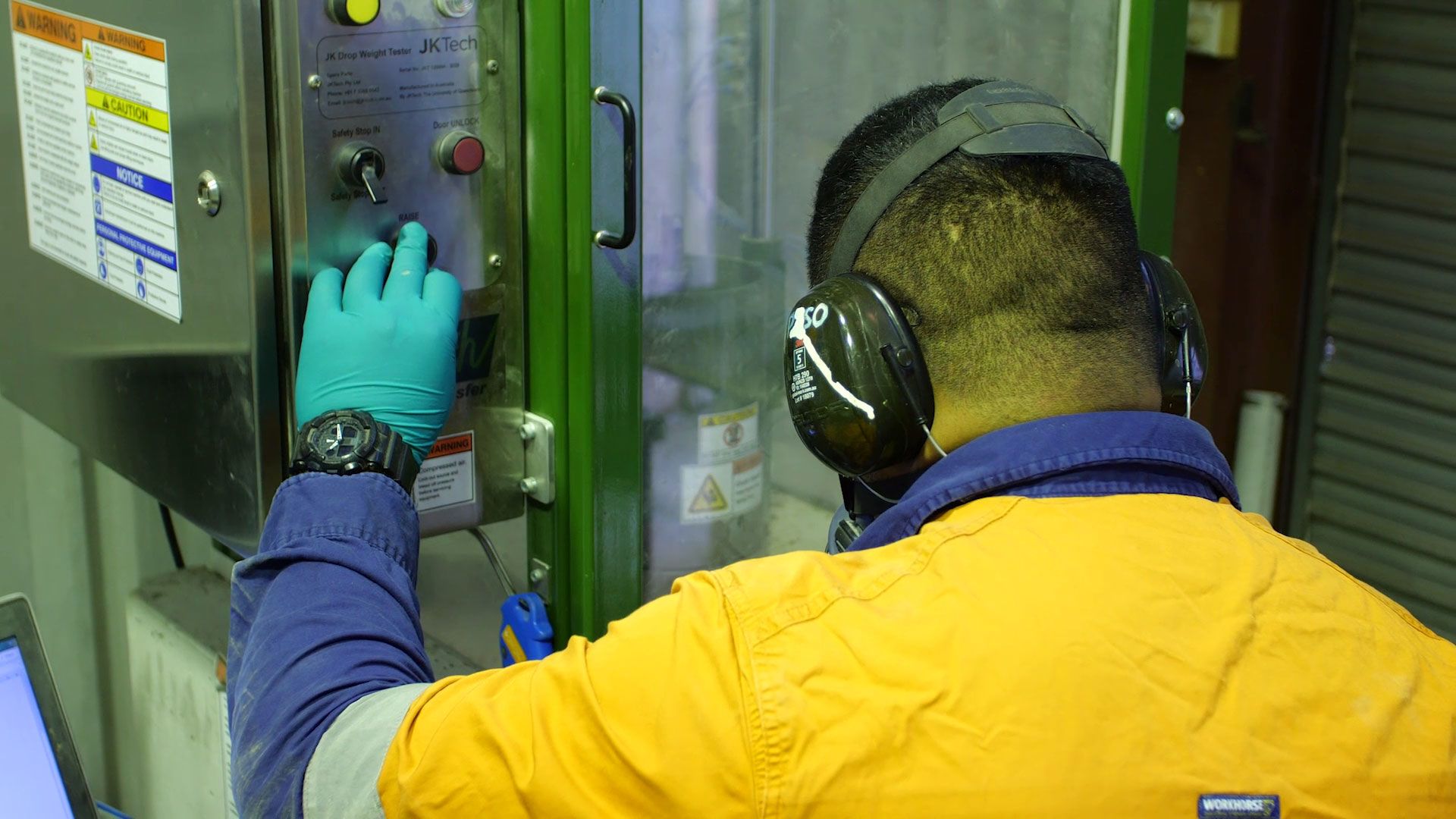 Operator using the JK Drop Weight Tester.