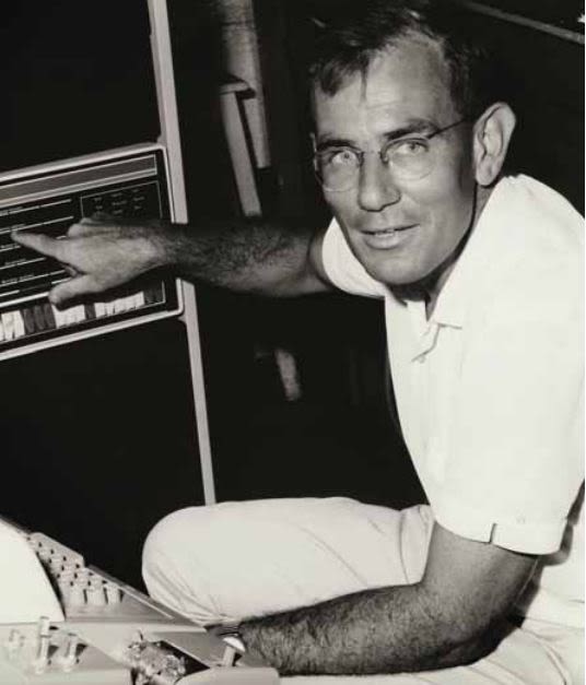 Alban Lynch sitting in front of an old computer