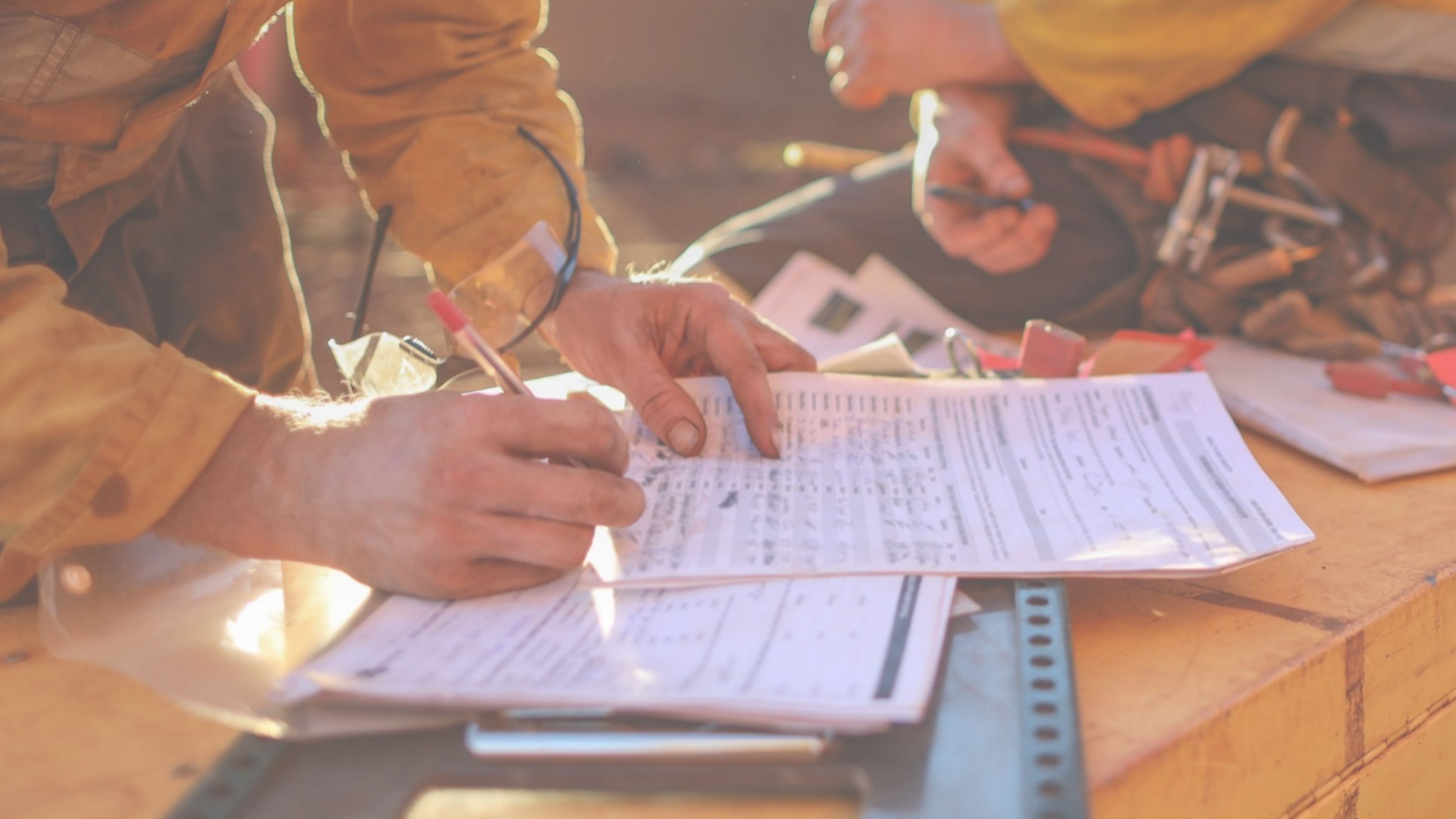 Mine worker hands filling a form
