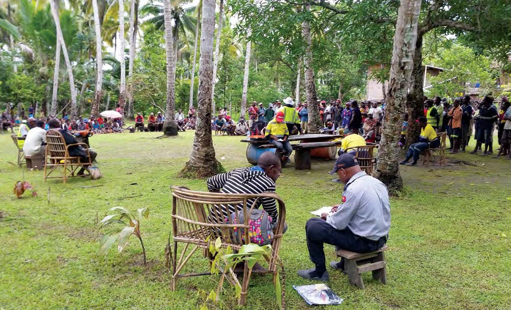 People meeting outdoors in community engagement.
