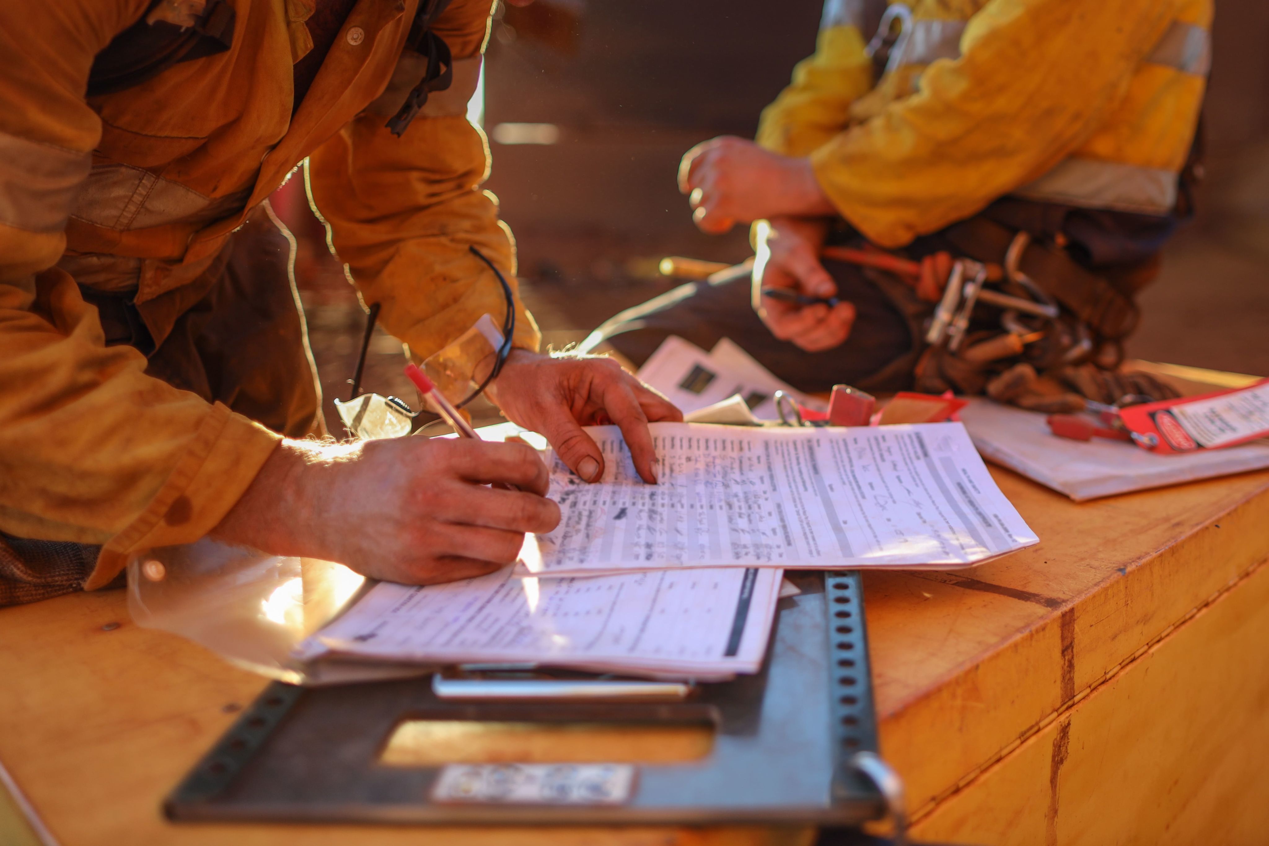 Mine worker hands filling a form