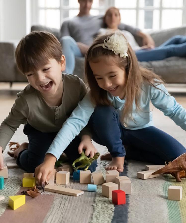 Baby boy and girl playing with toys